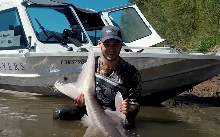   YP POSING WITH A STURGEON  