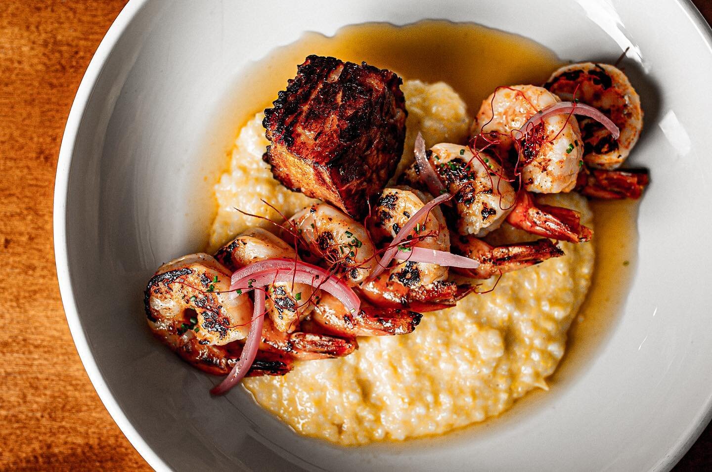 Make your reservations to enjoy our New menu! SHRIMP &amp; GRITS blackened shrimp, house-ground white corn grits, braised bacon, pickled onions, ham broth  #flxfood #rocfoodies #rochesterny #rochesternewyork #fingerlakesny #fingerlakesregion #rocfood