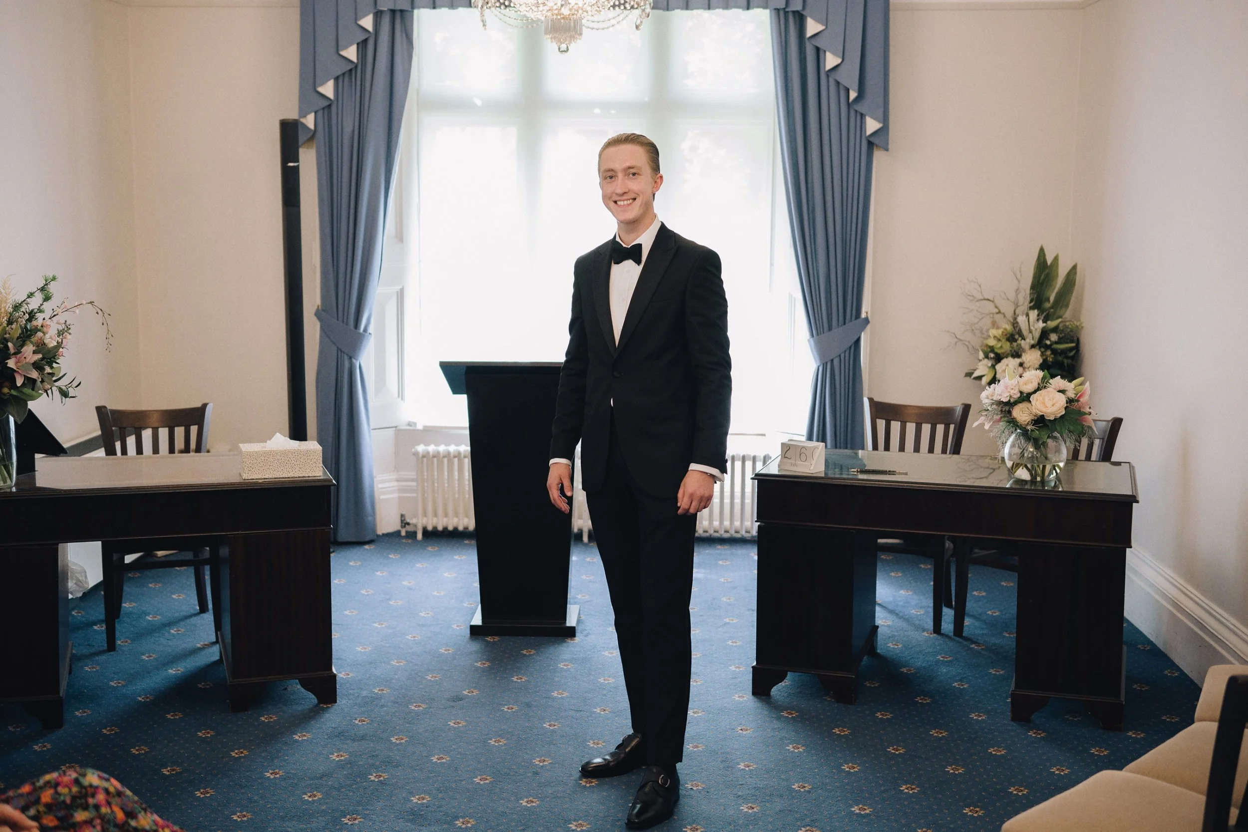 Groom waiting for the bride inside the ceremony room in Surrey