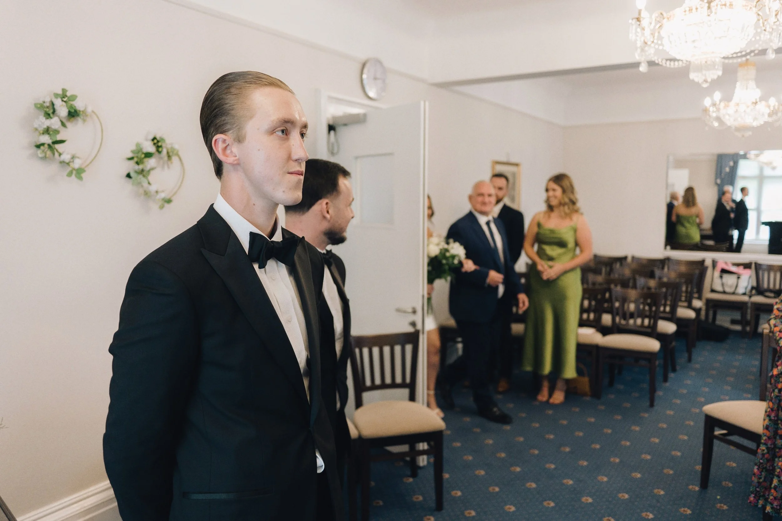Groom looking nervous as the bride enters the ceremony room
