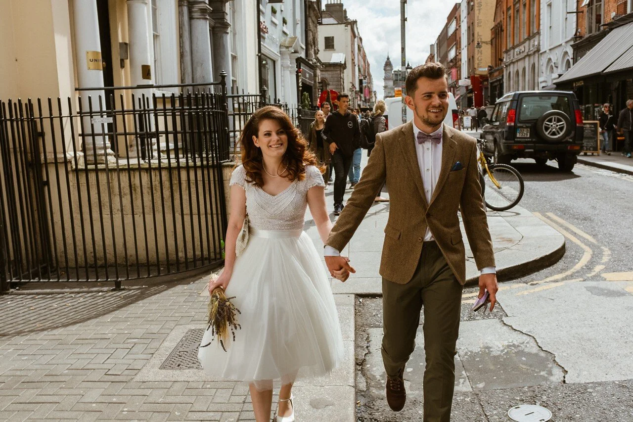 Couple walk outside for photos after wedding ceremony