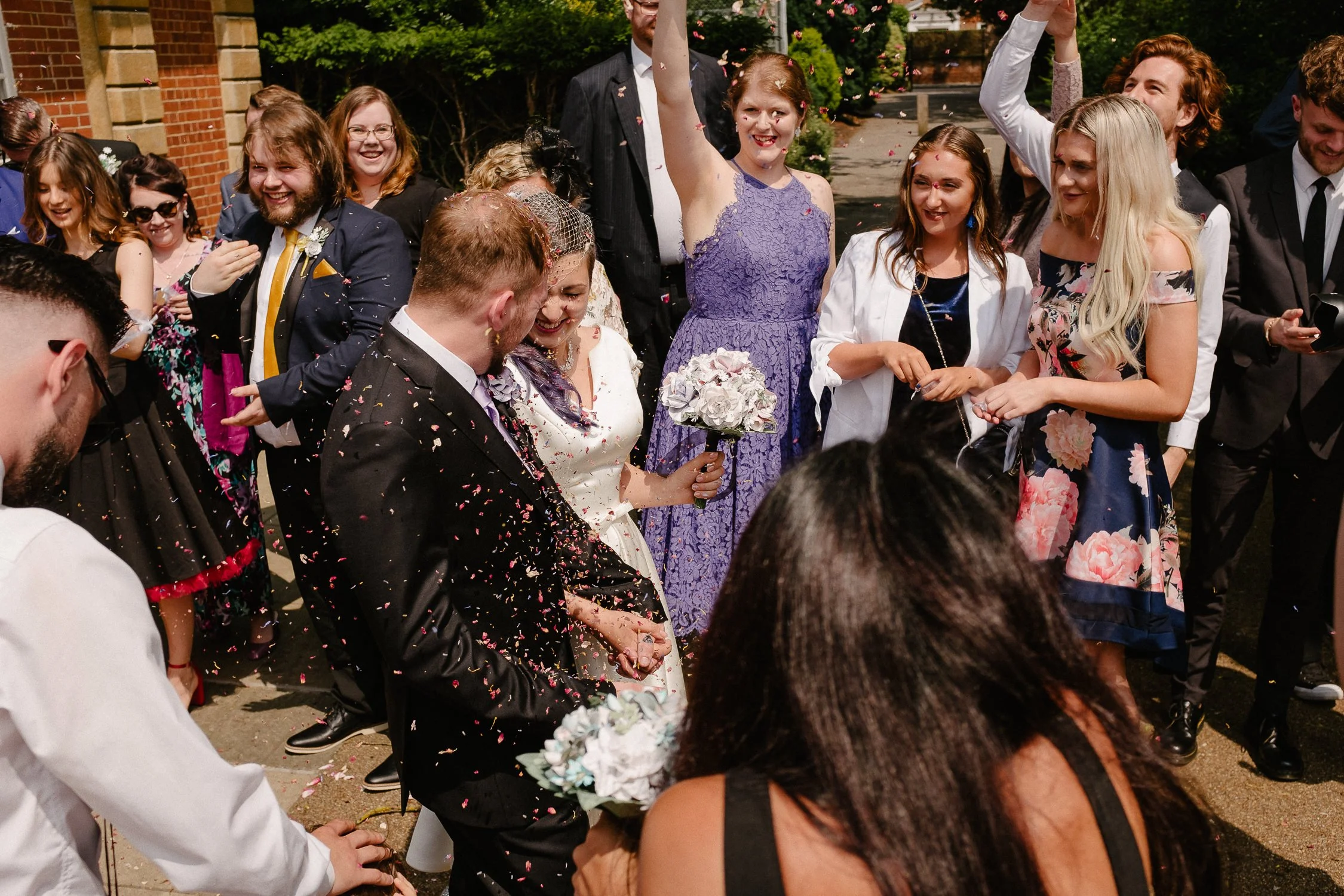 Surrey wedding photographer UK captures moment guests throw confetti