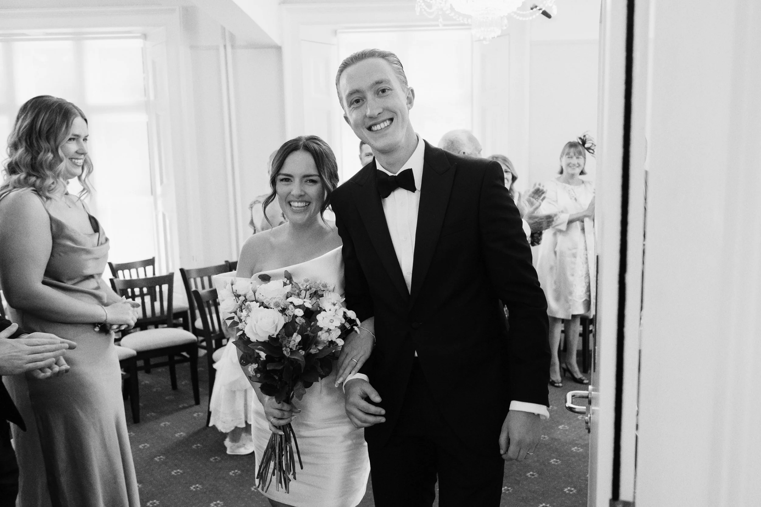 Bride and groom leave the ceremony room