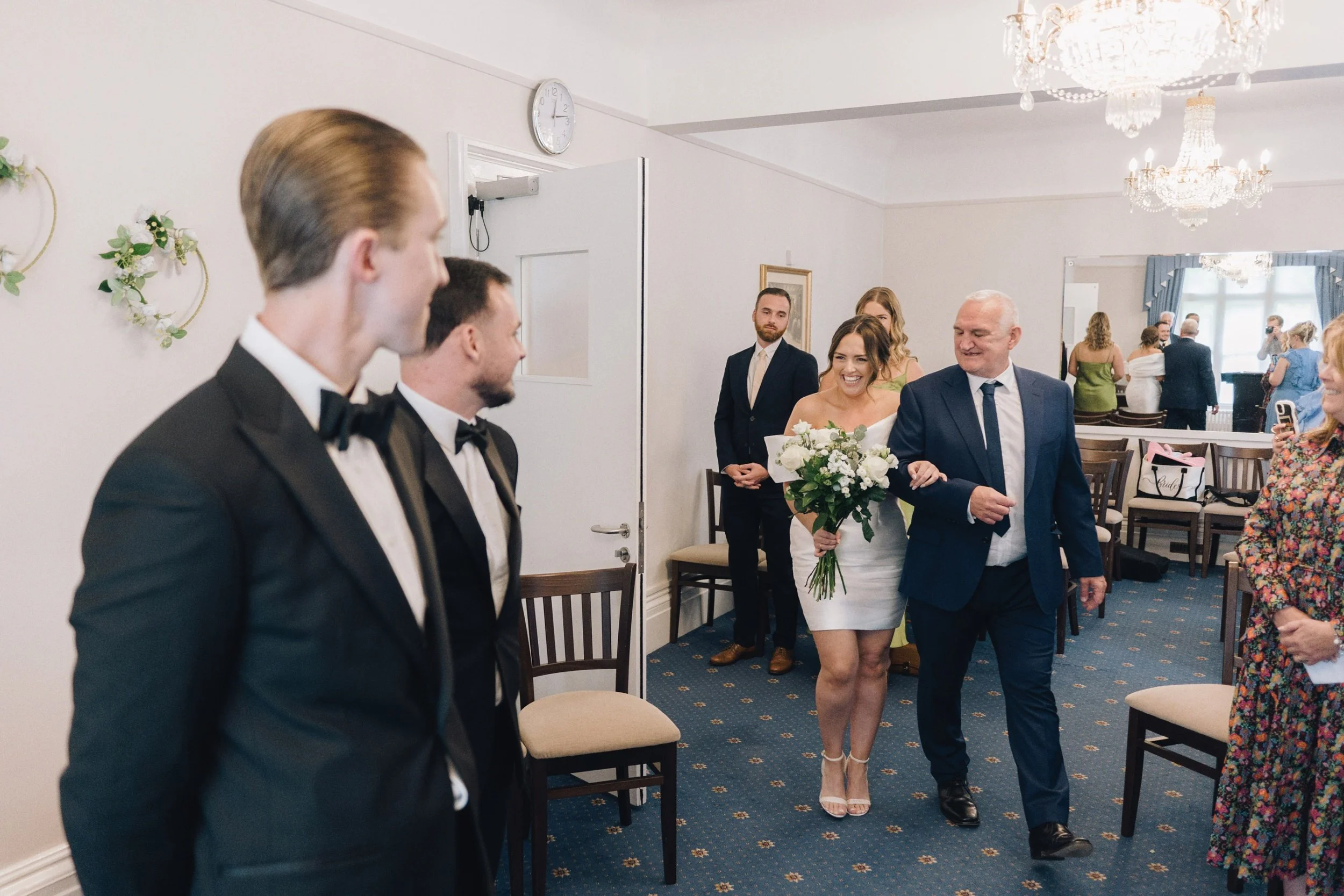 Groom sees bride for the first time as she walks down the aisle