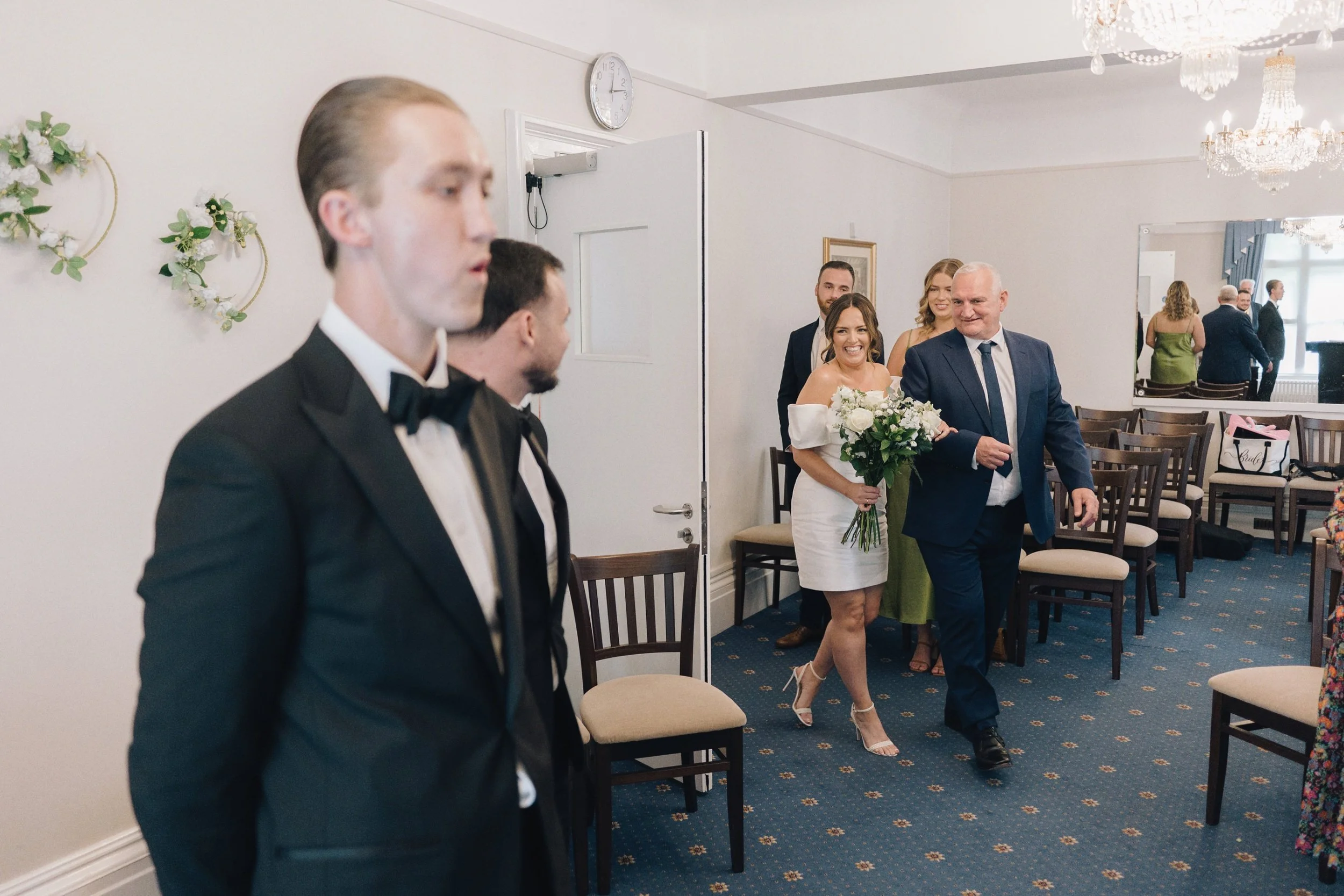 Groom takes a deep breath as his bride enters Guildford Registry Office