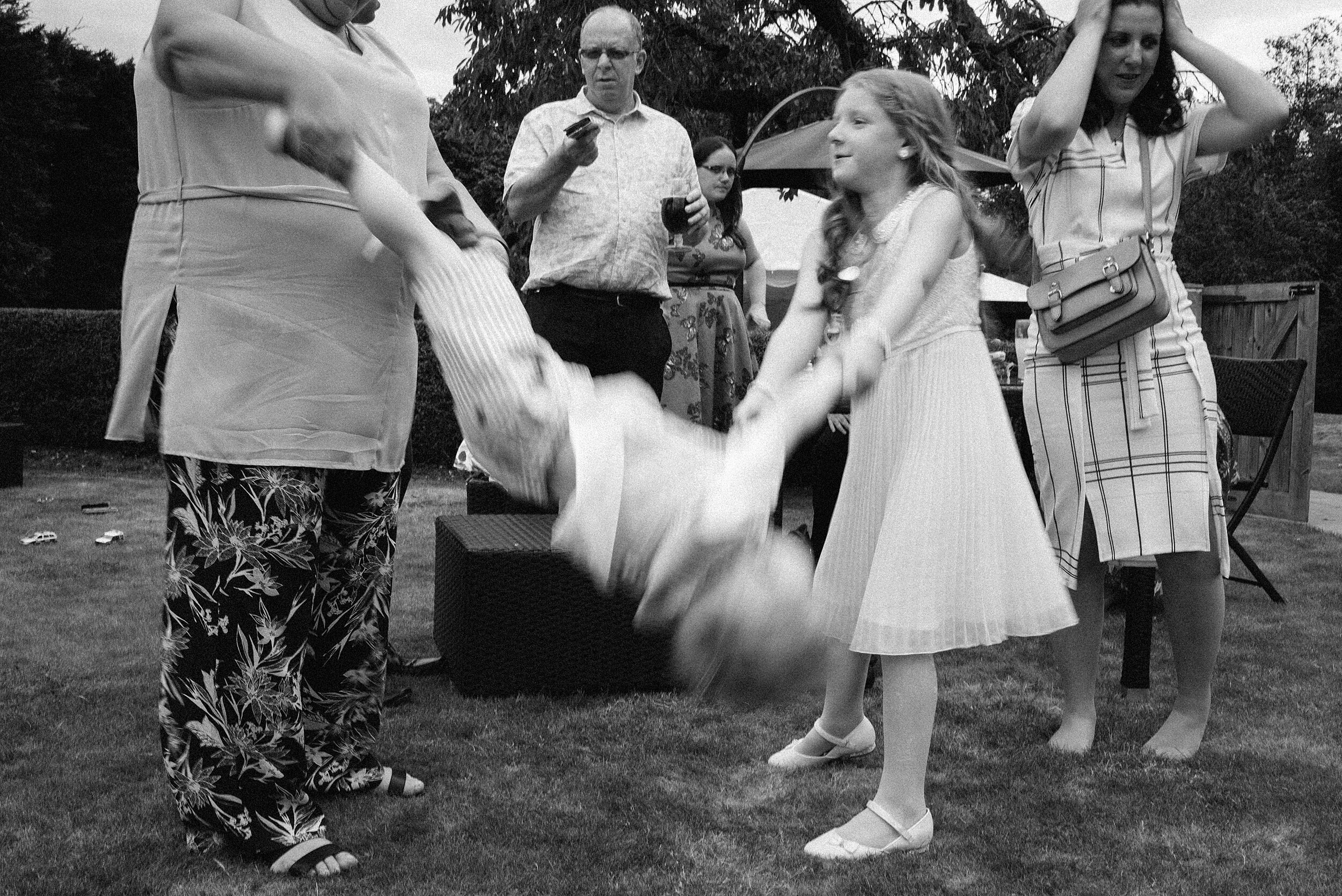 Surrey wedding photographer photographs guests outside hampton court palace golf club