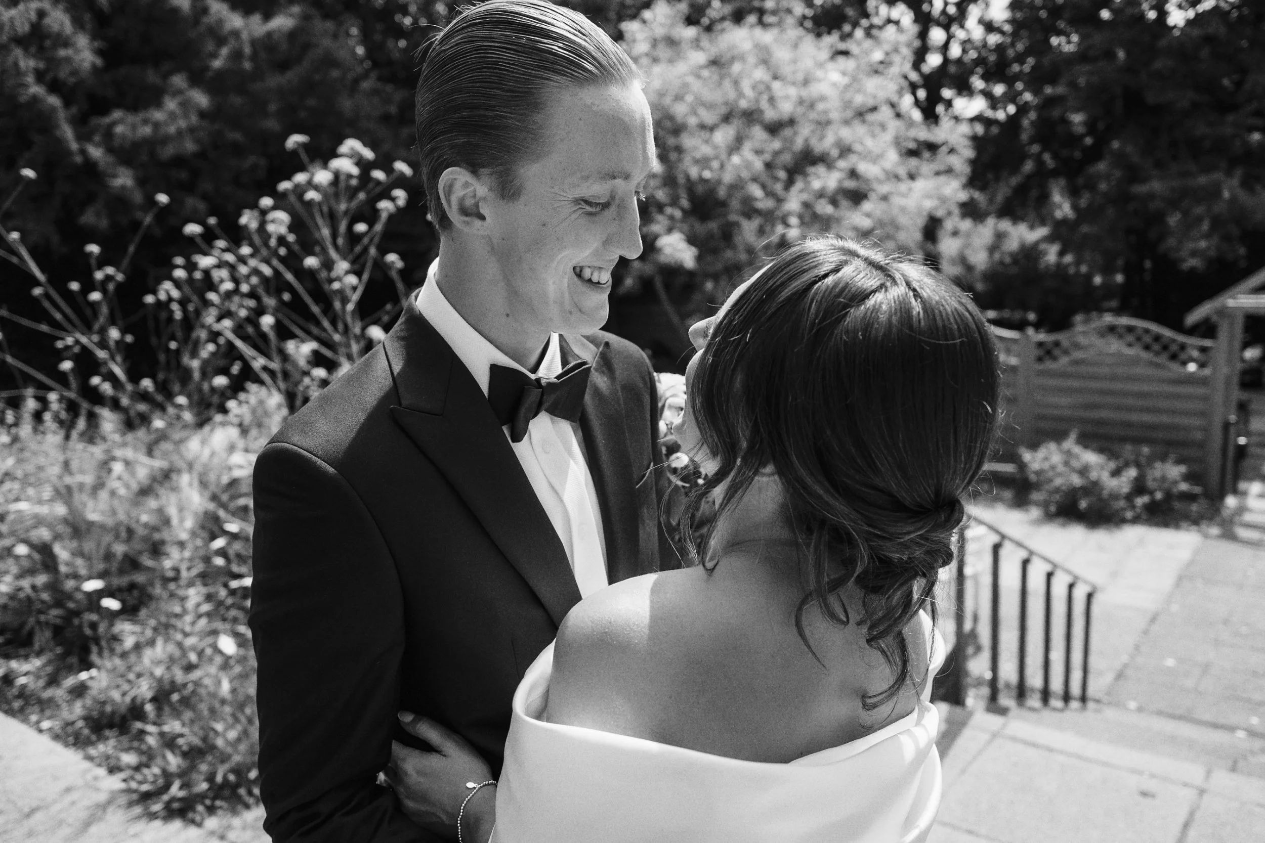 Wedding photographer captures photo of couple outside their wedding venue in Guildford Surrey