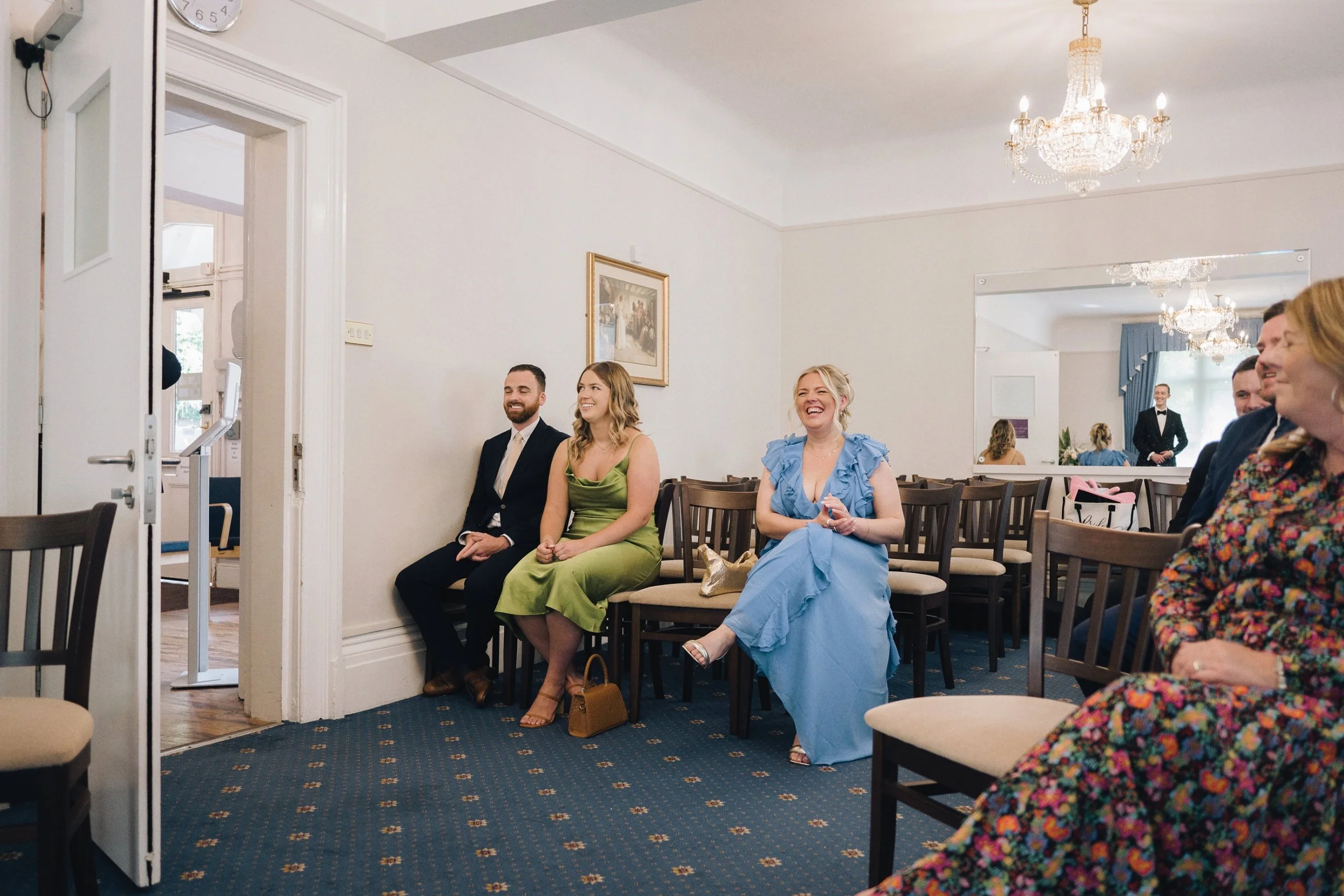 Guests sitting inside the Guildford ceremony room as they wait for the bride