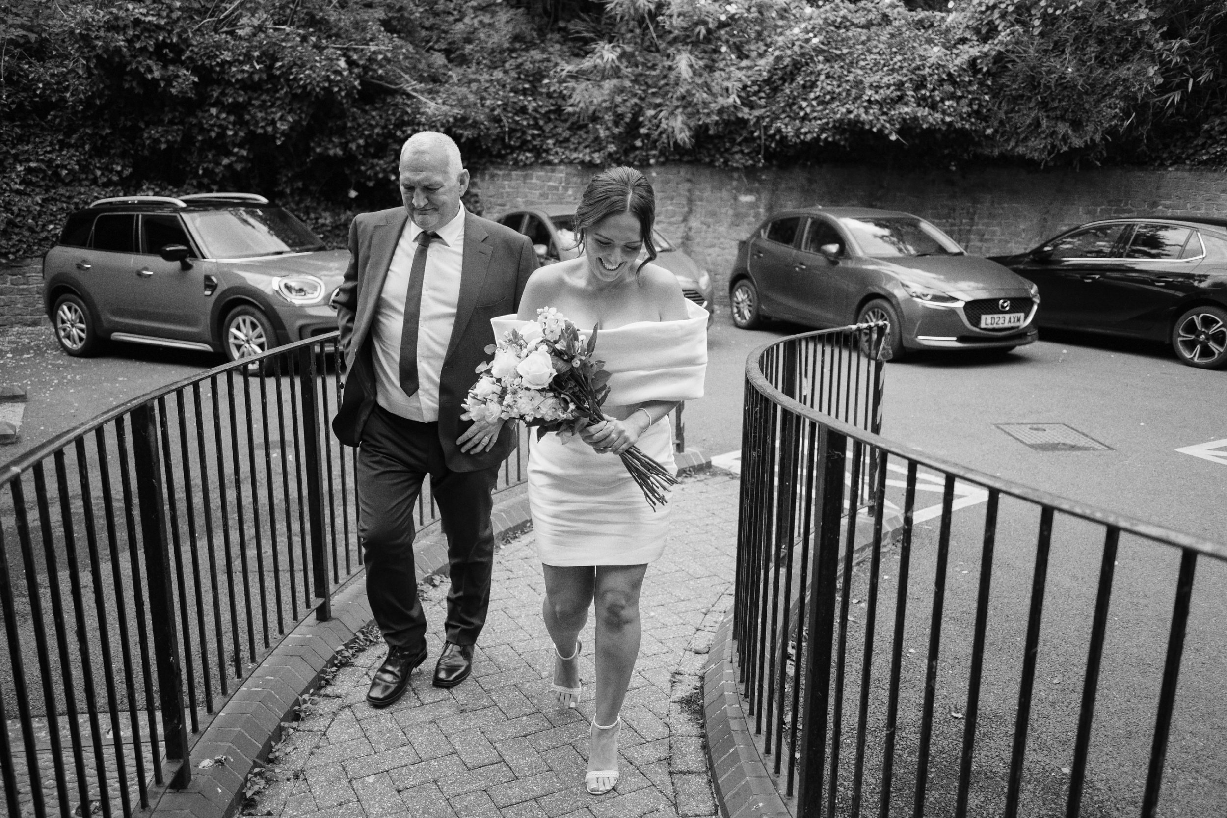 Bride and her father about to walk down the aisle at Guildford Register Office