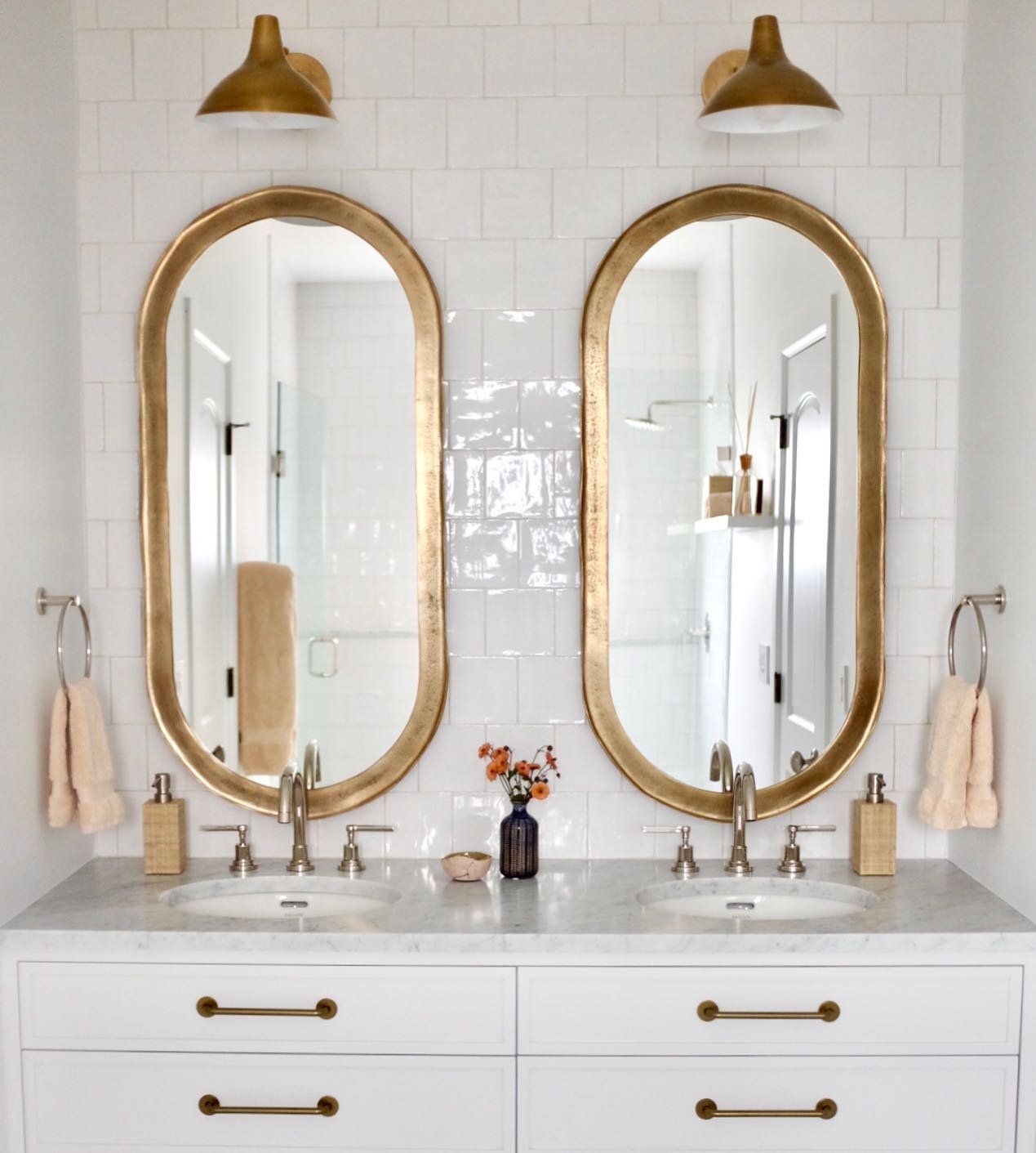 Subway tiles are nice&hellip;.but I am really loving these little undulating square tiles in our recent guest bath remodel. Juxtaposed them with rounded hardware, @cb2 mirrors and lights! #mycb2