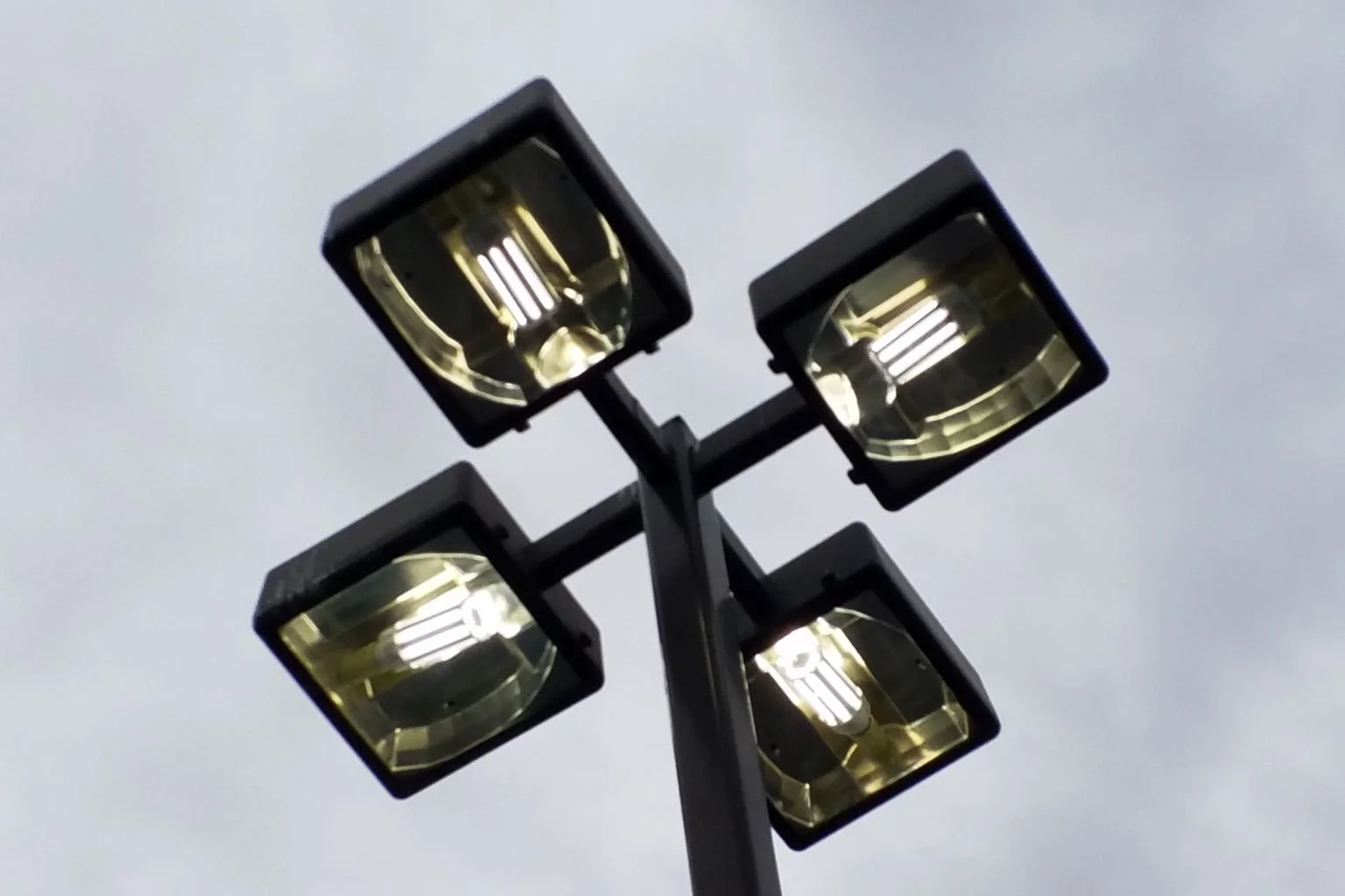 LED parking lot light fixtures installed by electrician at a strip mall in Hesperia California, upgraded from metal halide.