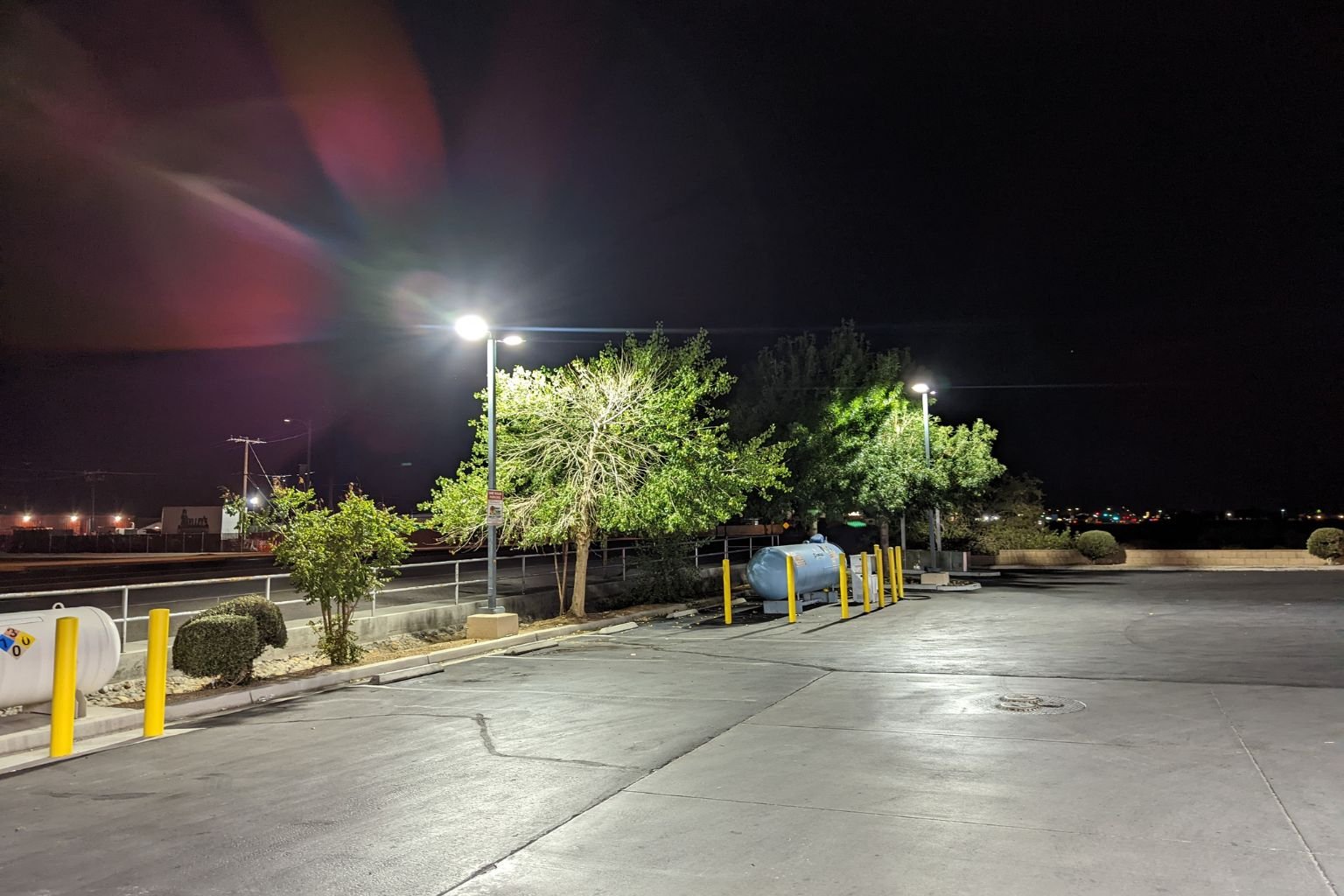 Professional parking lot lighting installation by MTE Electric in the Town of Apple Valley, showing bright LED light coverage from new LSI fixtures at a local service station.