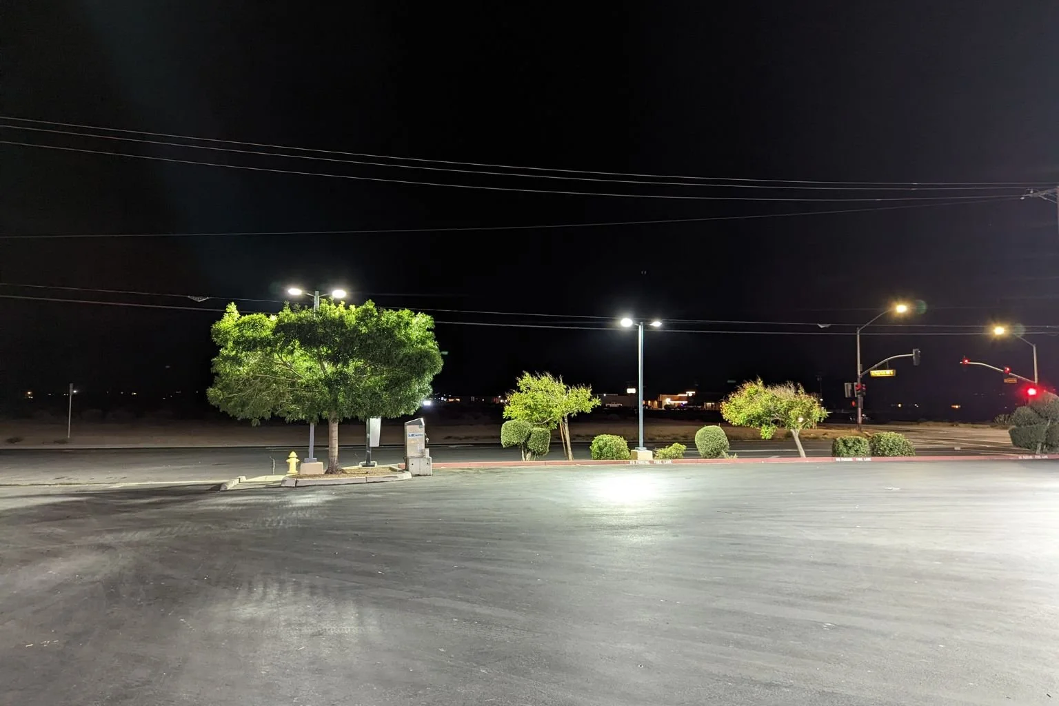 MTE Electric's commercial parking lot lighting installation in the Town of Apple Valley, showing bright, uniform LED light spread across a large asphalt lot.