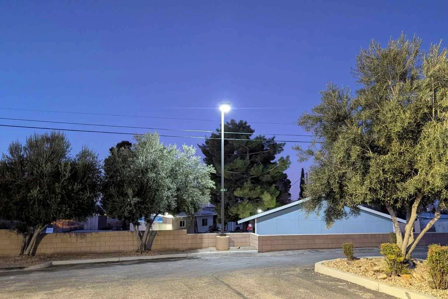 LED parking lot light illuminating the rear parking area at Family Medical Center in Phelan, California, following a commercial parking lot lighting upgrade completed by MTE Electric.