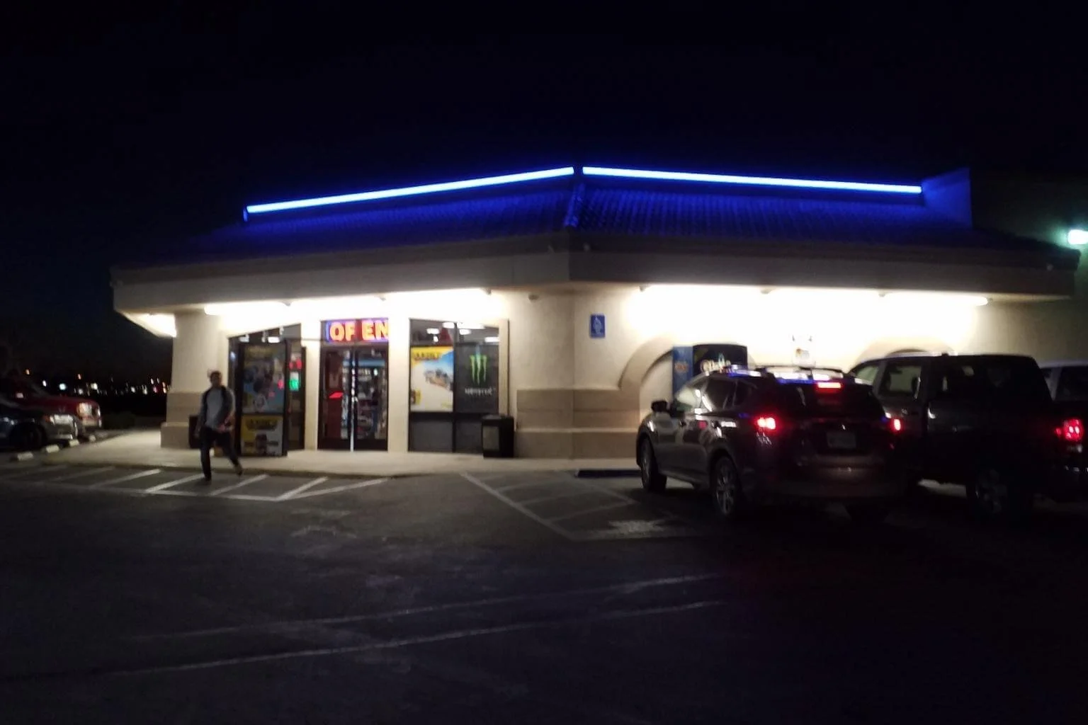 Commercial electrician replaced aging red neon roofline lighting with color-changing LED accent lighting at a Chevron service station in Apple Valley, enhancing the building's nighttime appearance and energy efficiency.