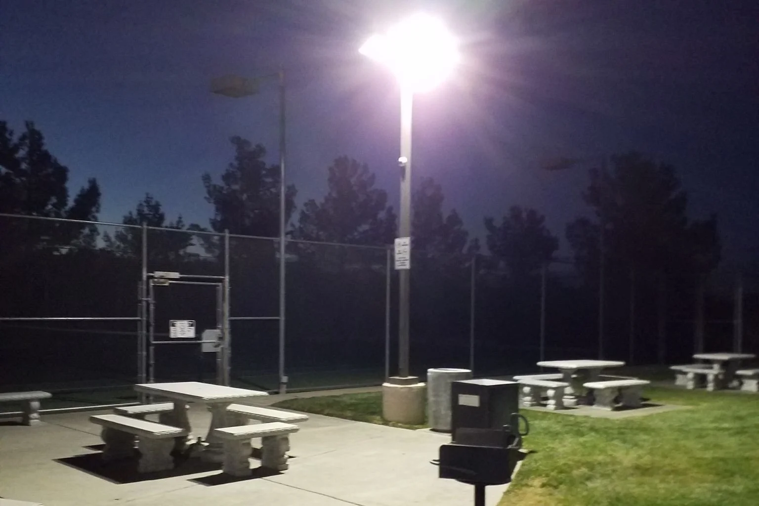 MTE Electric's electrician add LED flood lights to the picnic area of this private park located in Victorville, California.