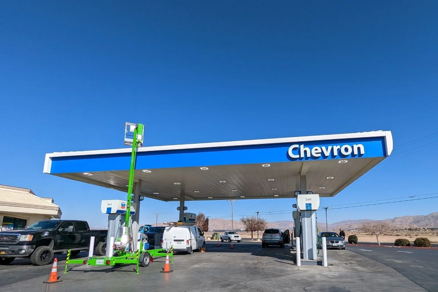 MTE Electric providing service and repair to canopy lights at an Apple Valley, California service station.