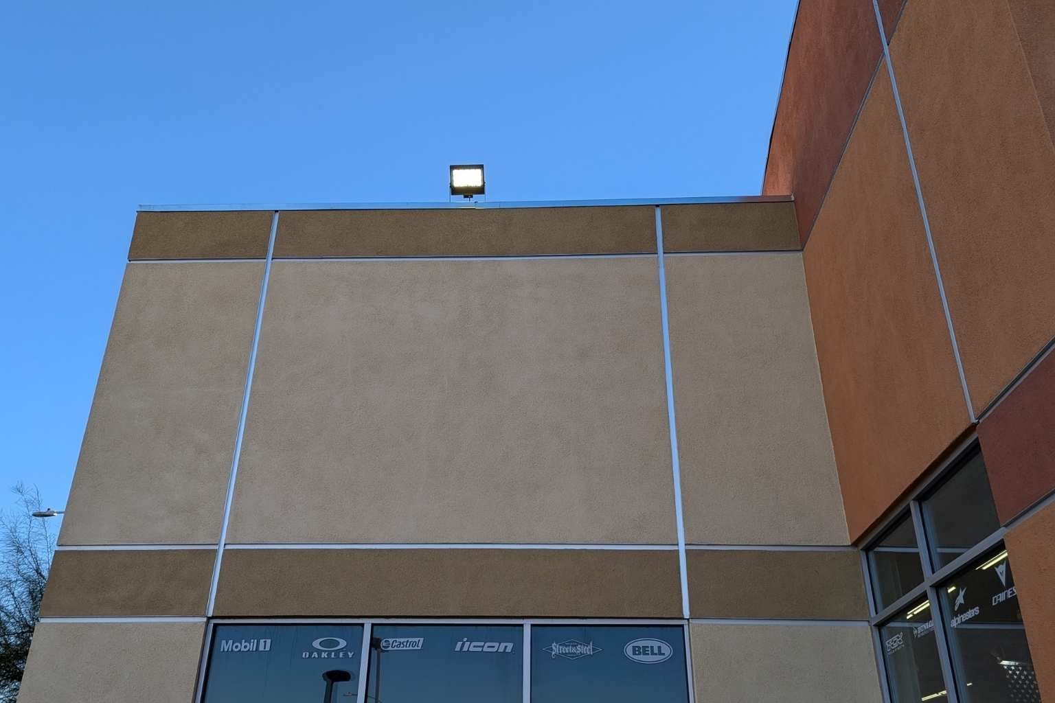 Second LED floodlight installed by MTE Electric on the Cycle Gear building in Victorville, CA to provide additional commercial parking lot lighting and improved nighttime safety.