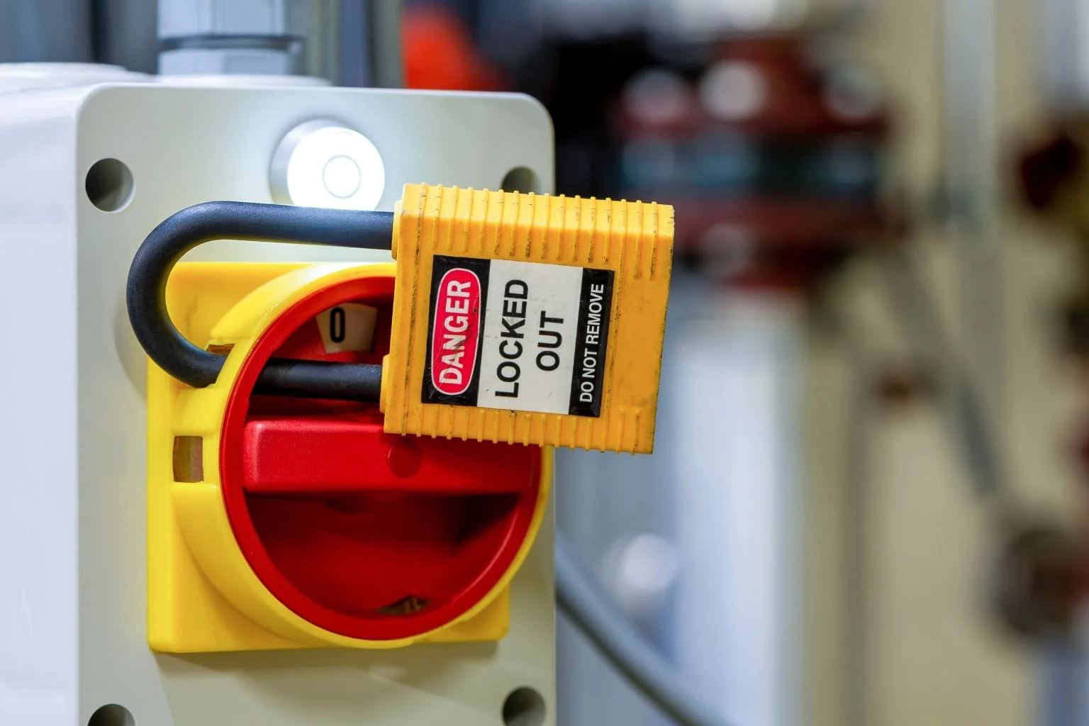 Electrician performing lockout tagout on electrical disconnect switch in Victorville, Apple Valley, and Hesperia to ensure safe electrical repairs.