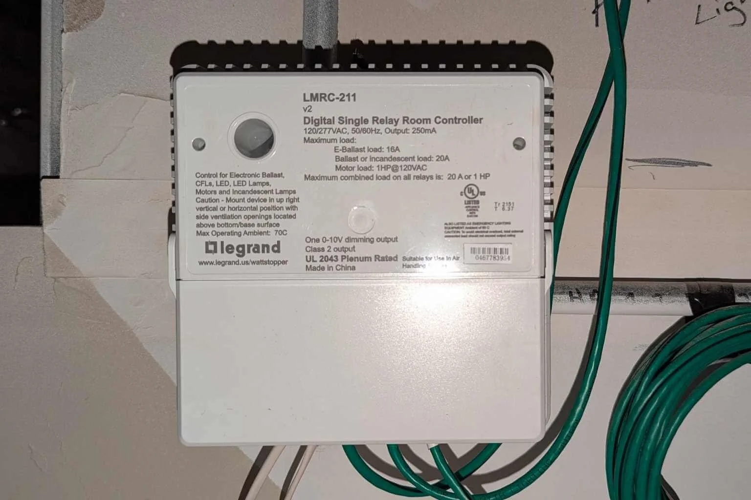 Commercial electrician servicing a Wattstopper digital room controller for an office lighting control system at a local water municipality building in Apple Valley, California.