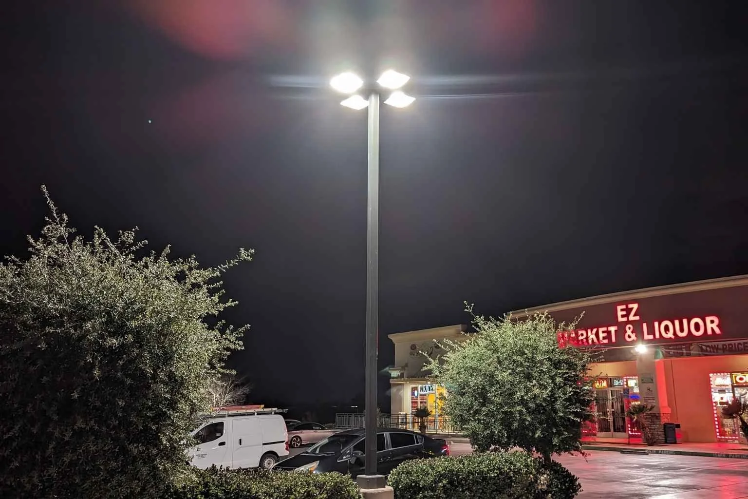 New LED parking lot light fixture installed by MTE Electric at Donert Plaza in Hesperia California improving commercial parking lot visibility and energy efficiency at night.