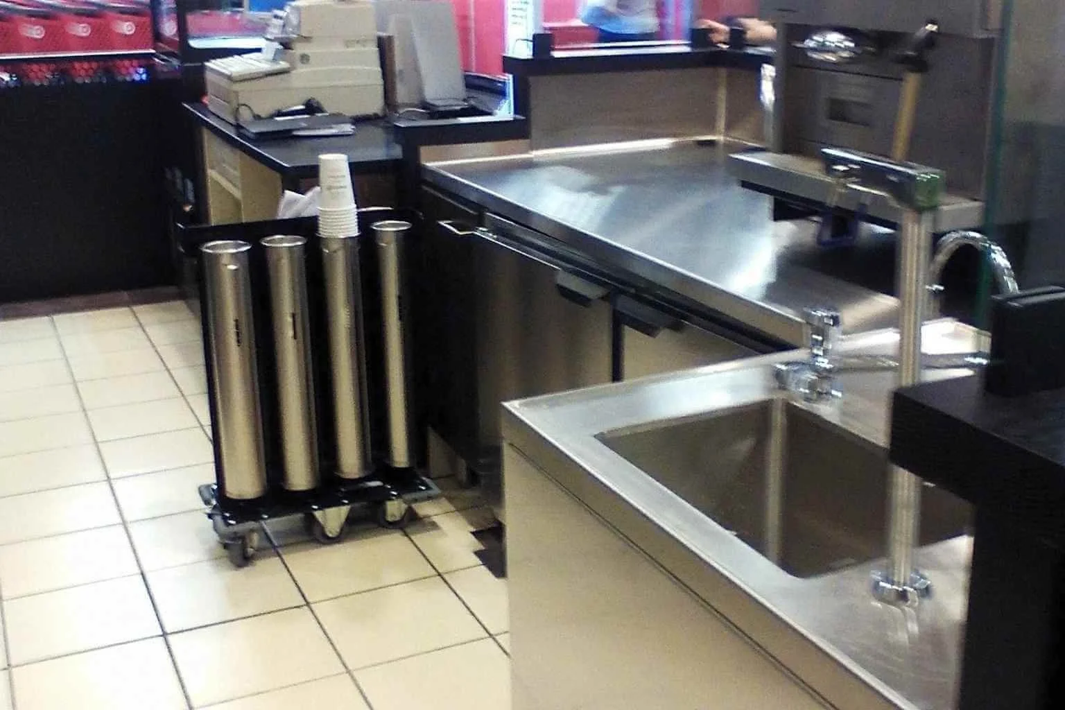 Commercial Starbucks work area inside Target in Apple Valley, California, showing refrigeration equipment, preparation counters, sinks, and equipment hookups completed during a tenant improvement electrical project by MTE Electric.