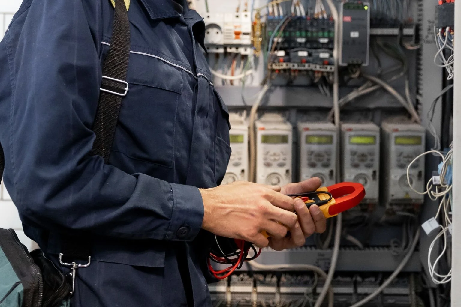 MTE Electric commercial electrician performing electrical troubleshooting on control panel in Apple Valley CA.