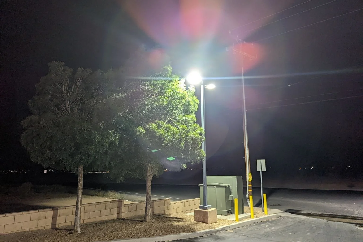Our electrician replaced an existing metal halide parking lot light  fixture with LED in Apple Valley, CA.