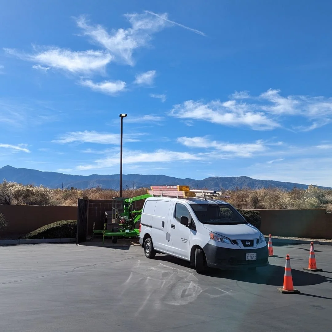 Our electrician troubleshooting a parking lot light pole in Phelan, California. The issue was traced to a faulty photo control, which we safely bypassed since the lighting is controlled by a timeclock inside the electrical room.