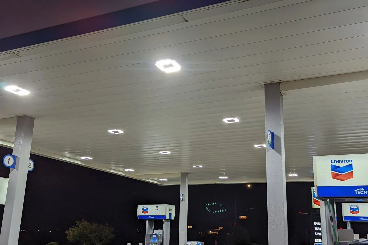 LED canopy lighting under gas station canopy at Chevron in Apple Valley CA showing bright uniform light output.