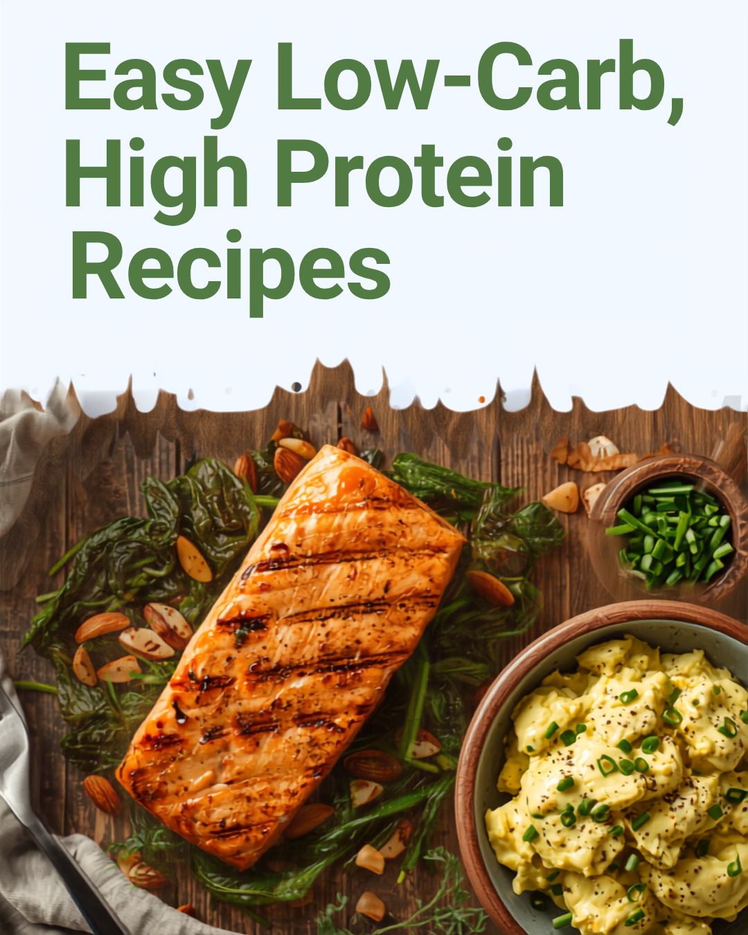 Grilled salmon fillet served with sautéed spinach, chopped almonds, and a bowl of mashed potatoes garnished with chopped green onions and black pepper on a wooden table.