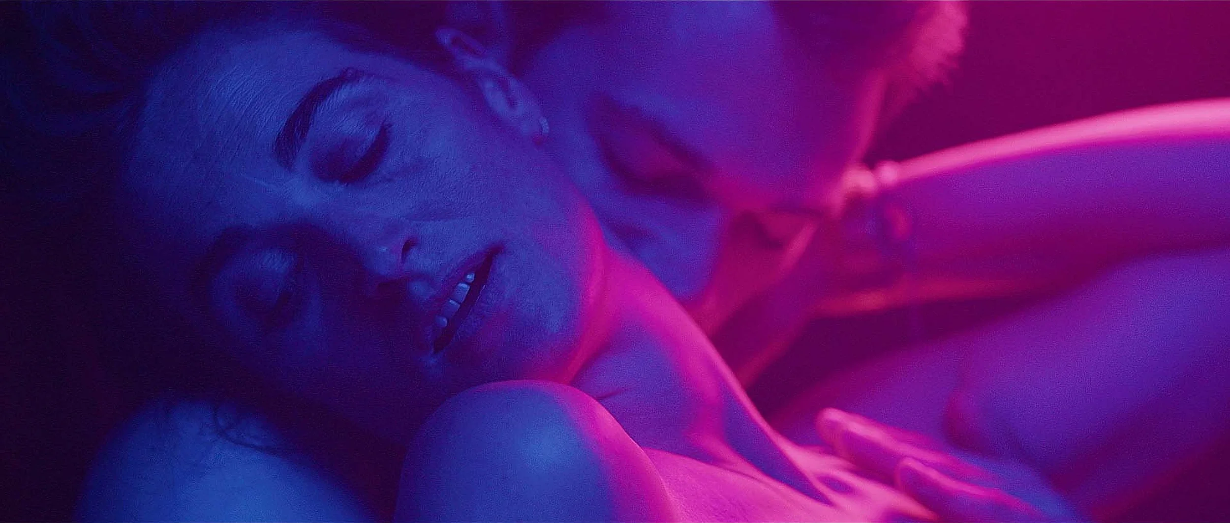 obsession-short-film-couple-neon-magenta-blue.webp