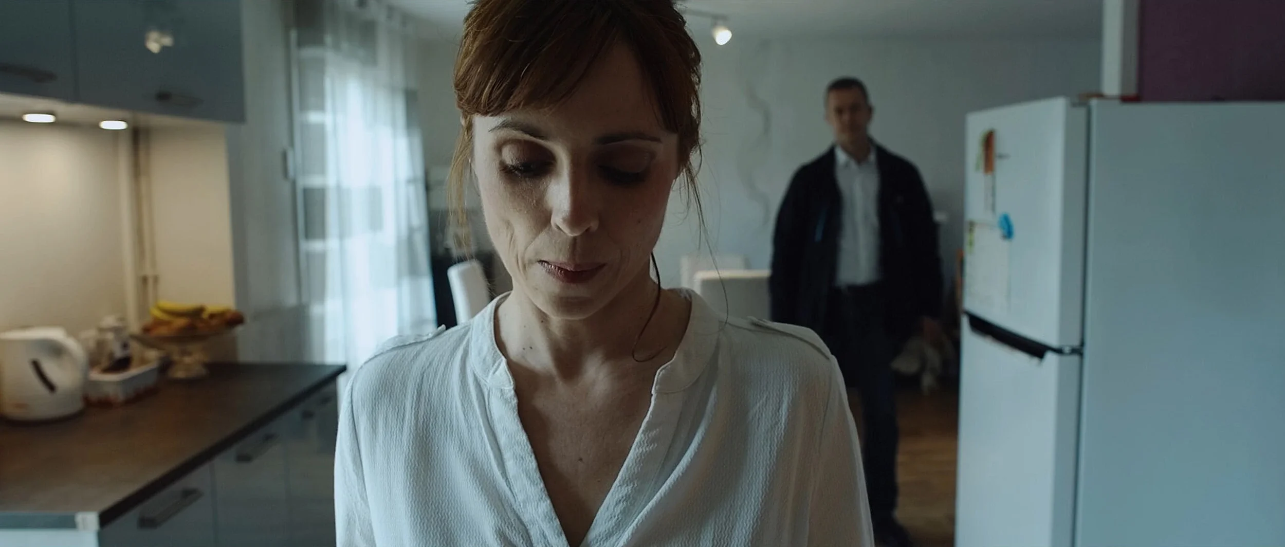 the-hire-short-film-woman-kitchen-man-doorway.webp