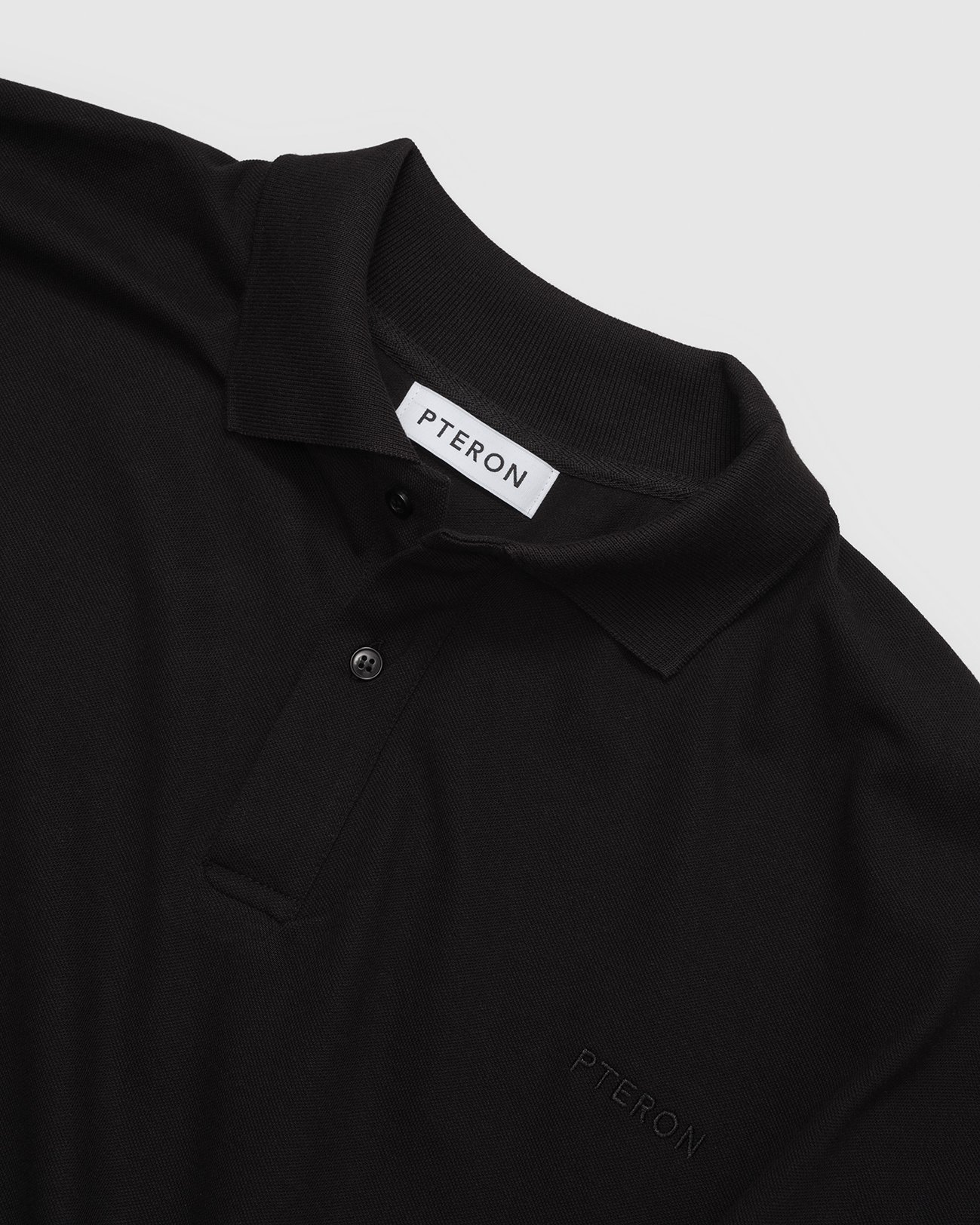 Pteron_Loosfitted_Polo_Black_D.jpg
