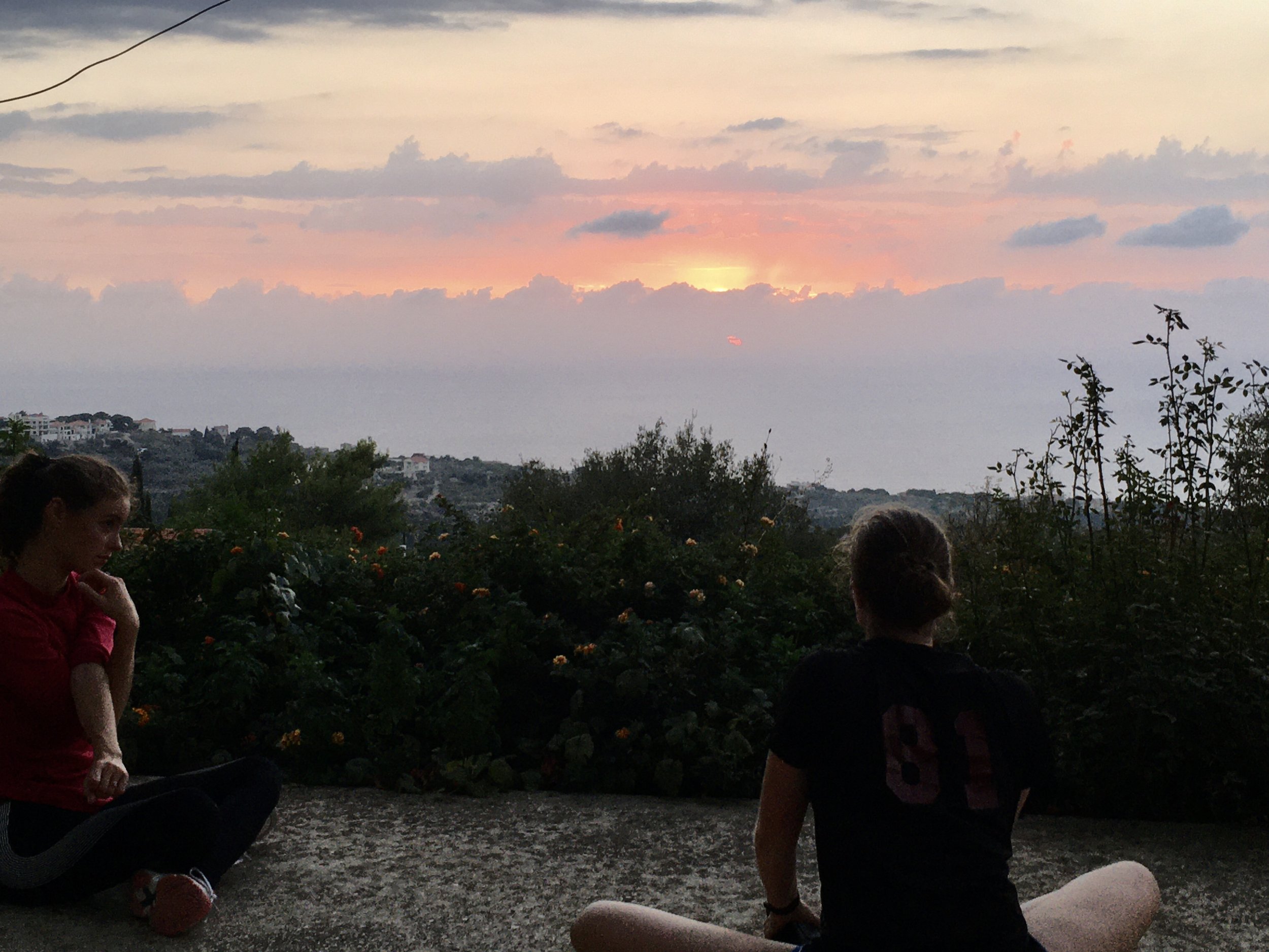 Post-workout stretch on the terrace as the sun goes down