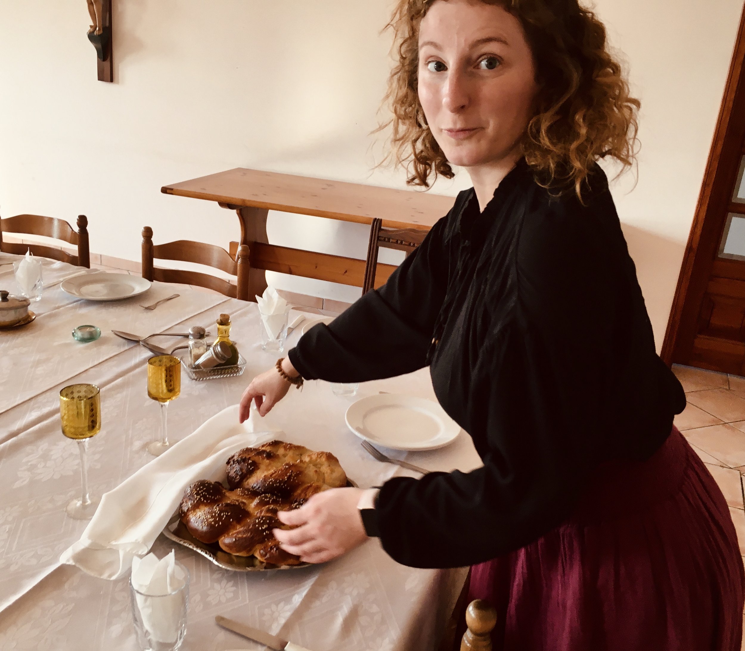 Julie taking a peek at the bread for Friday night’s prayer that we have with during our meal