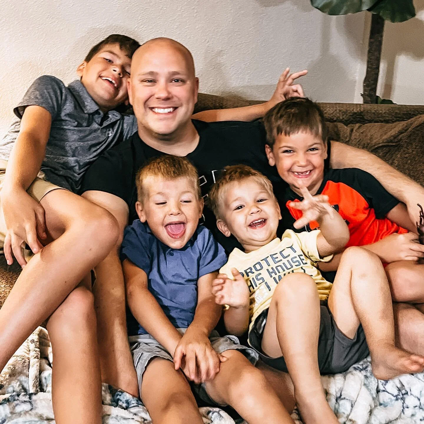 Typical scene in this house. Baby girl is either with mom or sleeping and daddy has a pile of boys in his lap!! We went around tonight and had the boys share their favorite thing about daddy and 3/4 said his snuggles. 🥰🥰🥰 the 4th simply said, &ldq