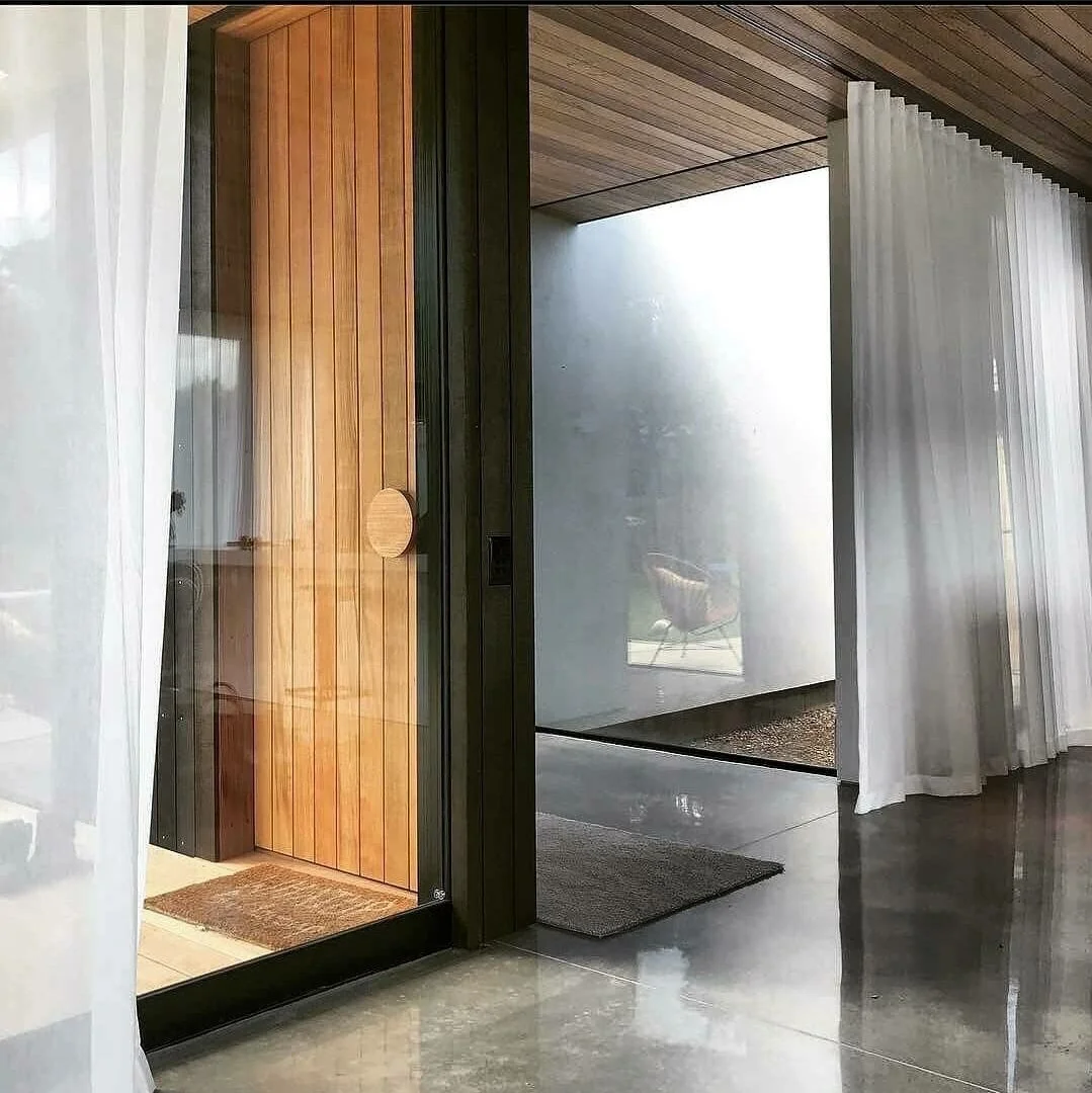 Instagram: Entry door feat Round timber pull handle at #anzacbayhouse by @johndeuchrassarchitects
