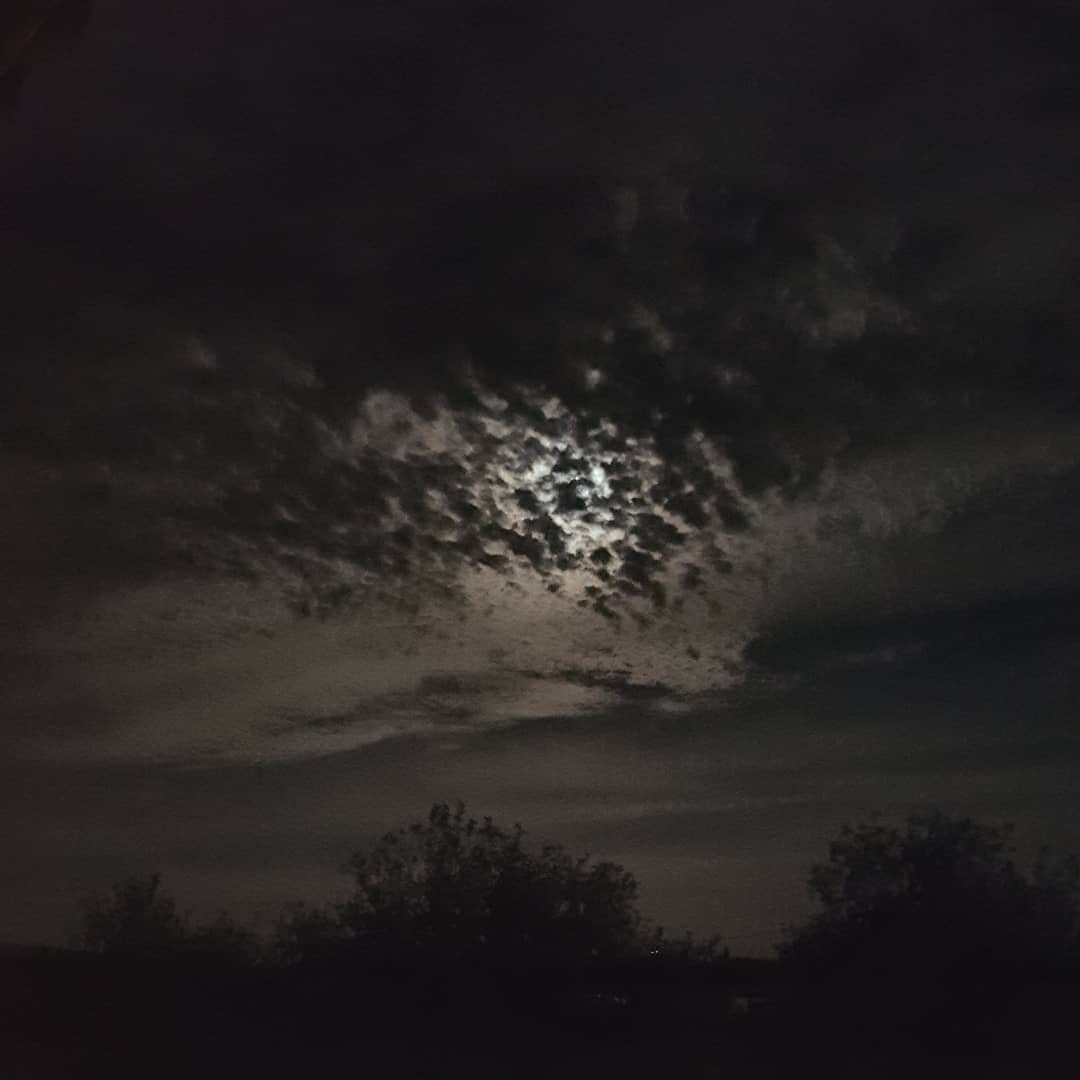 Full Moon waxing. No Filter. Gorgeous in the clouds.