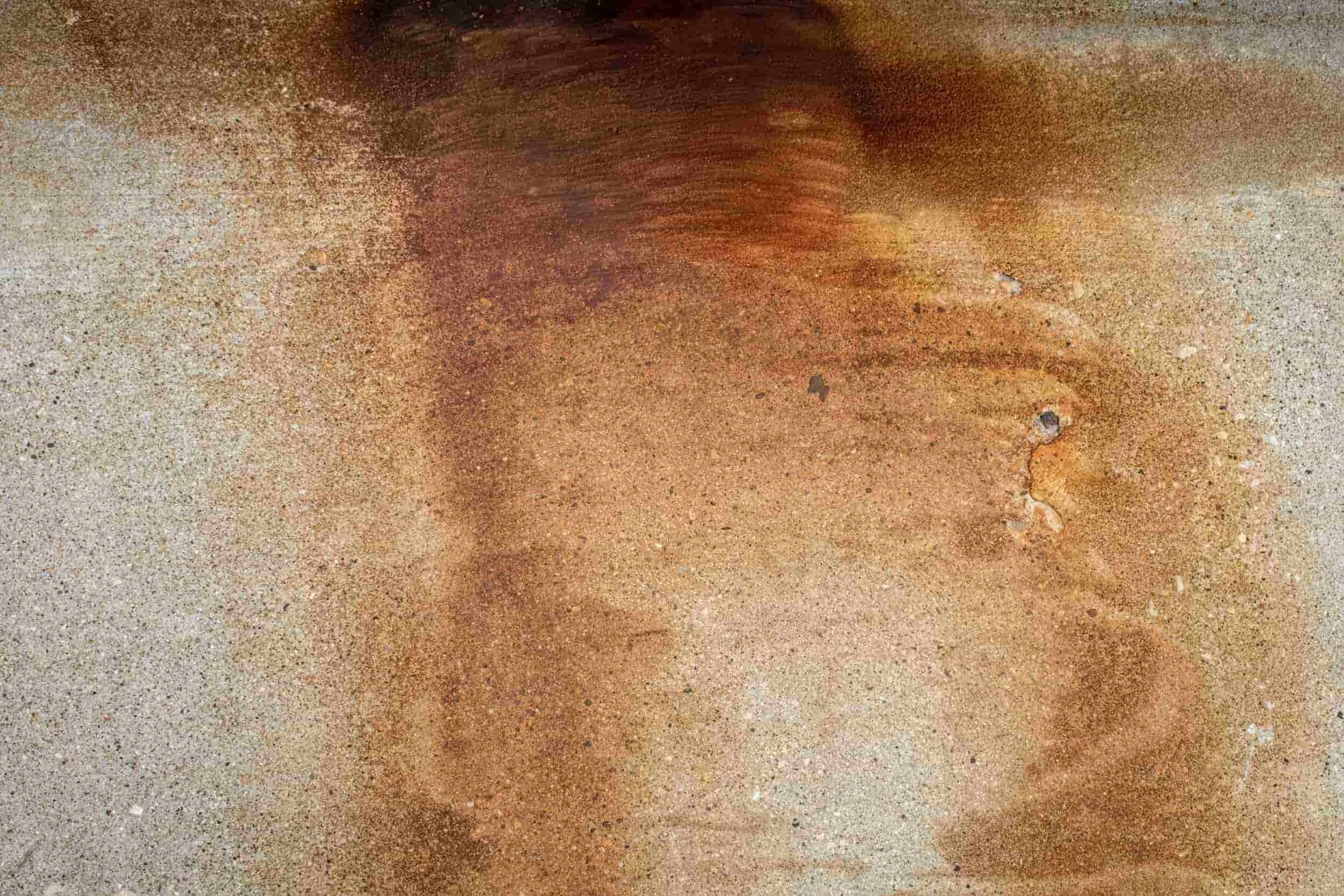 large orange colored rust stain on concrete