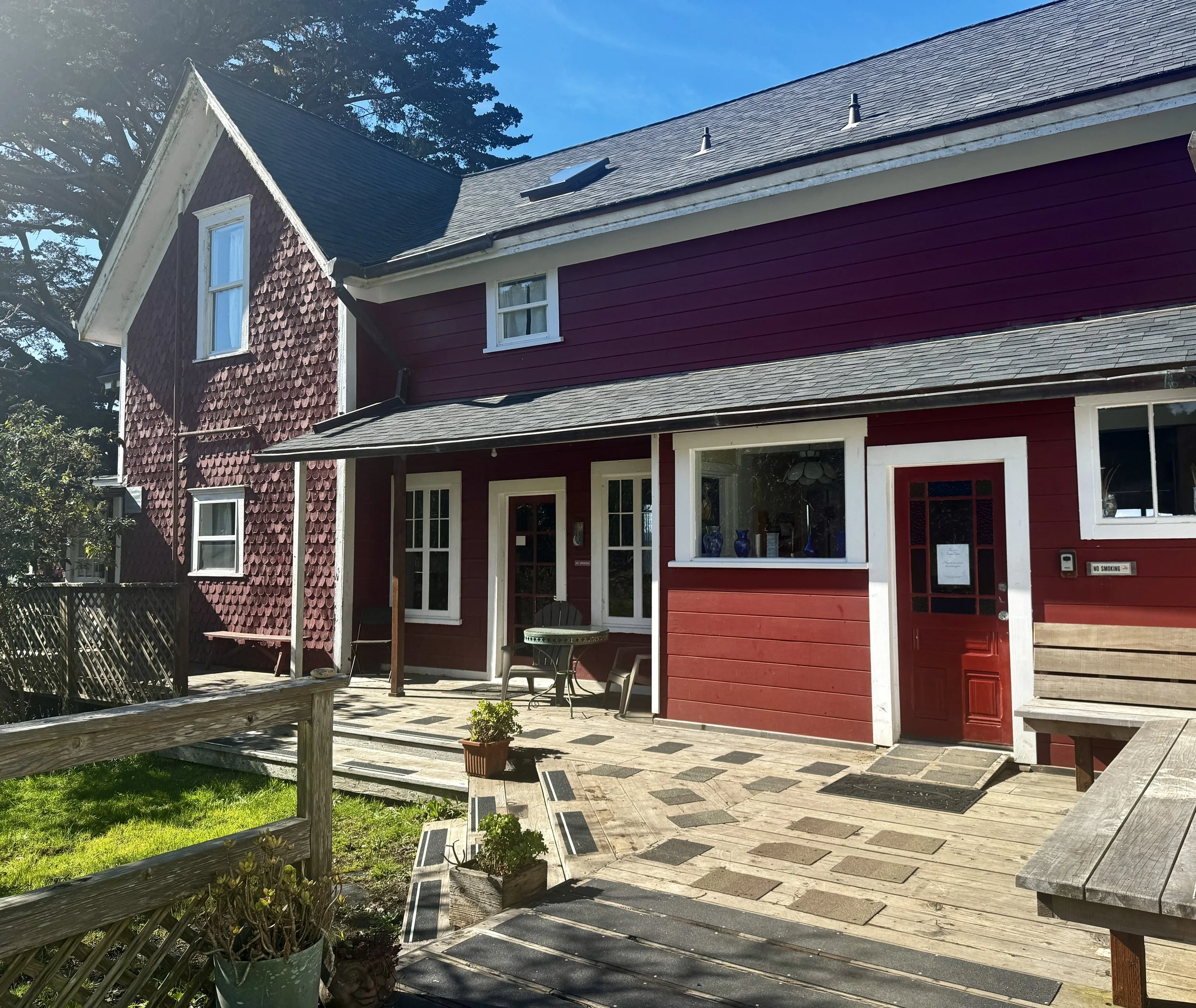 Sunshine hits the back deck, where you'll find the primary entrance to the Farmhouse.
