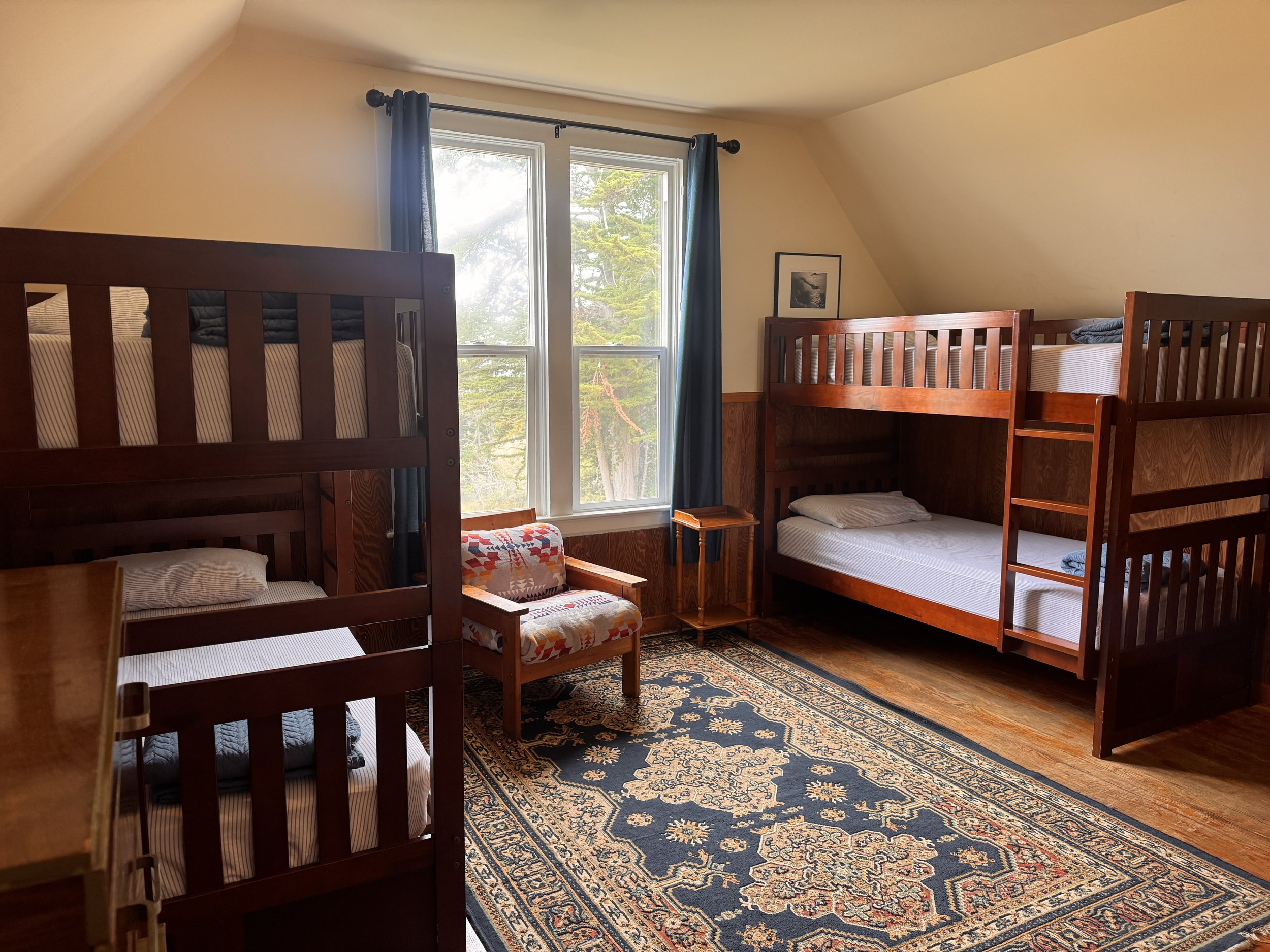 Bedroom #5 - The Osprey Room - features three sets of bunk beds (six twins total) and a gorgeous view of the ocean.