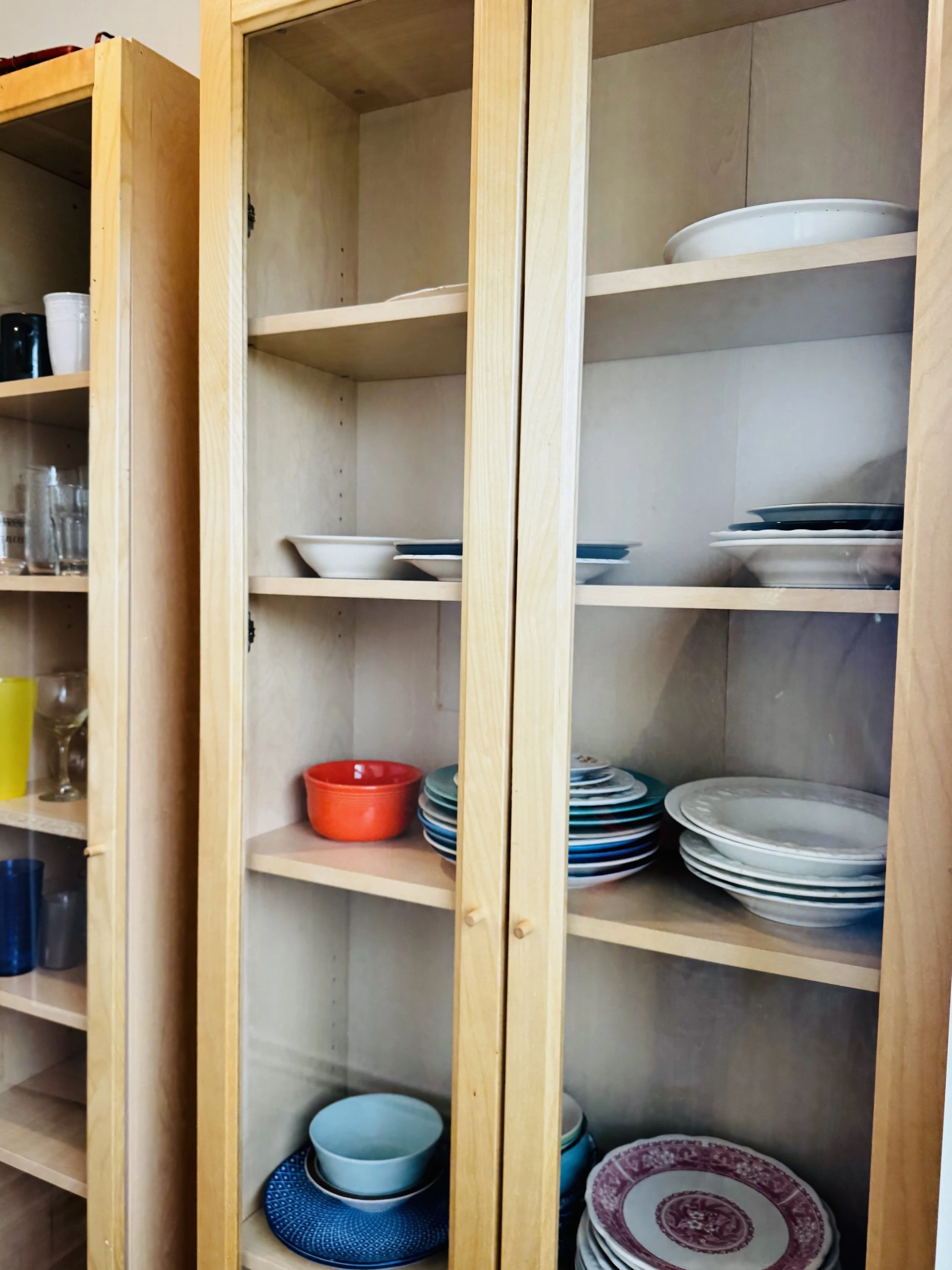 The pantry in the Shared Kitchen - basic cookware, dishes, and utensils are all provided.