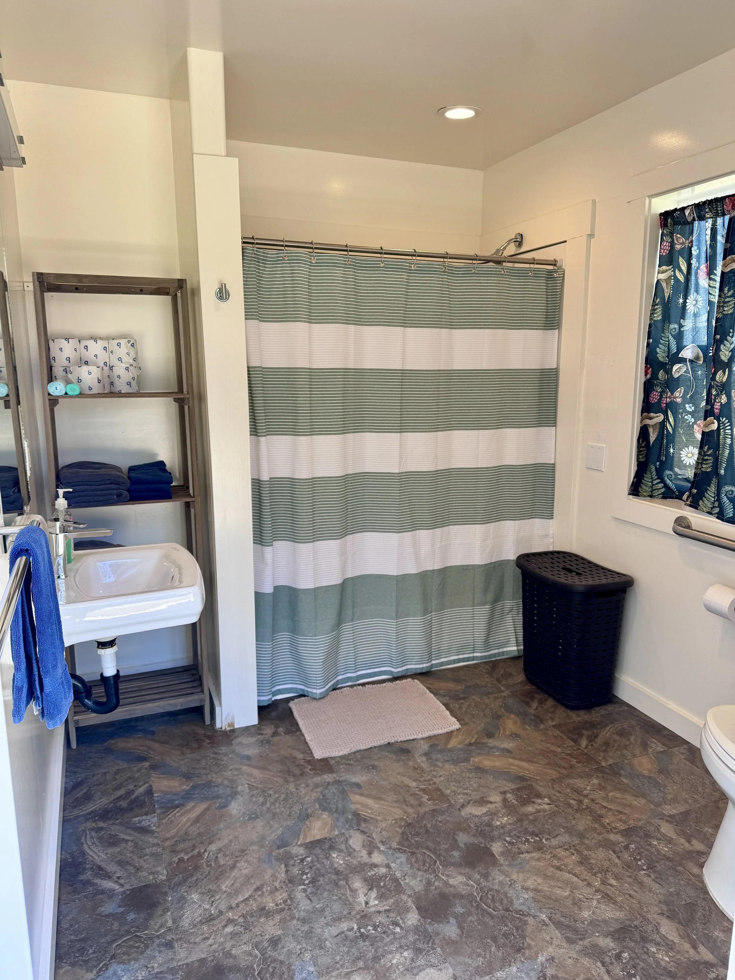 Shared Cabin Bathroom - This full bathroom is located in our "Top of the Hill" building and services The Orchard, Eucalyptus, and Grand Fir cabins plus the office.  