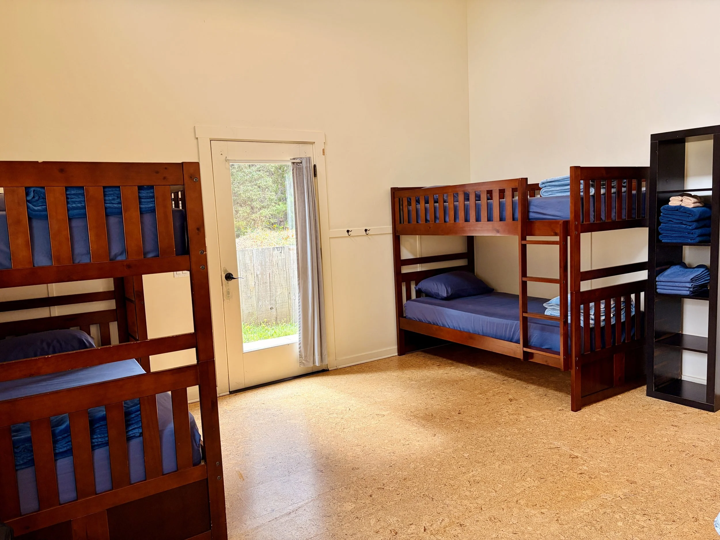 I call the top bunk!  Grey Fox and Blue Heron each have two sets of bunk beds in addition to a Queen bed.  Pygmy Forest and Redwood each have one set of bunk beds, a Queen bed, and a couch or futon.  