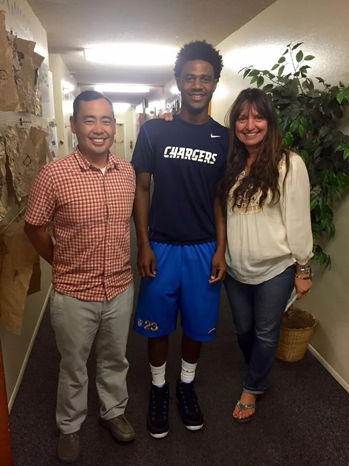 Picture of Jalen with school leaders Donny and Sherry