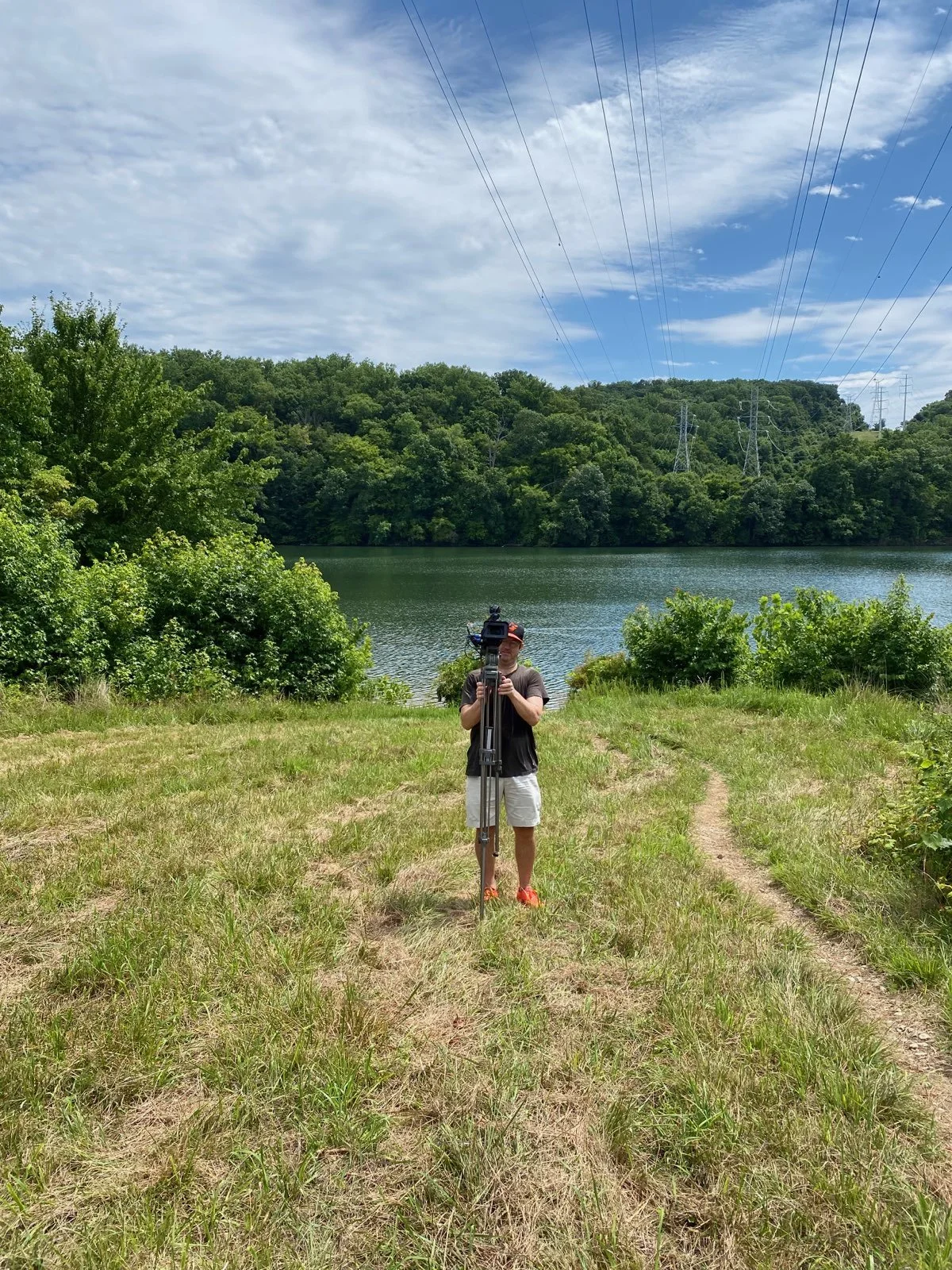 the director, cinematographer, sound man and grip for this is location seen here in his sweatiest..