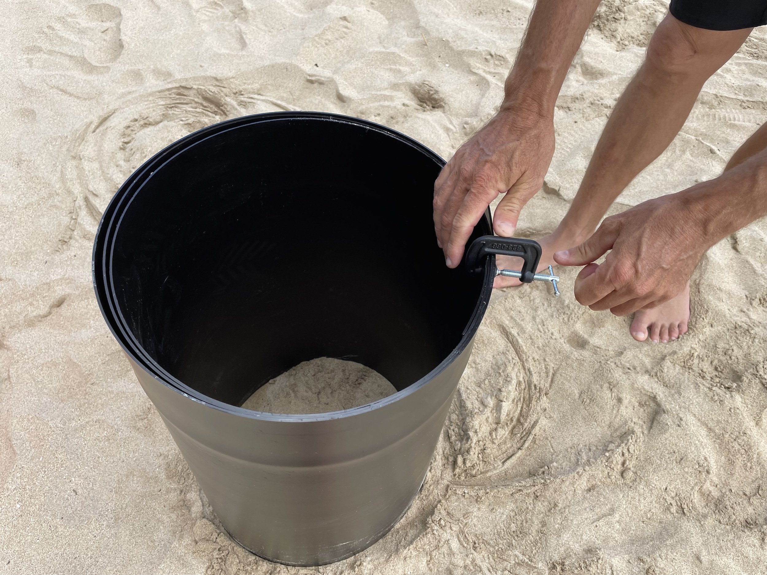 form to compact sand at the beach