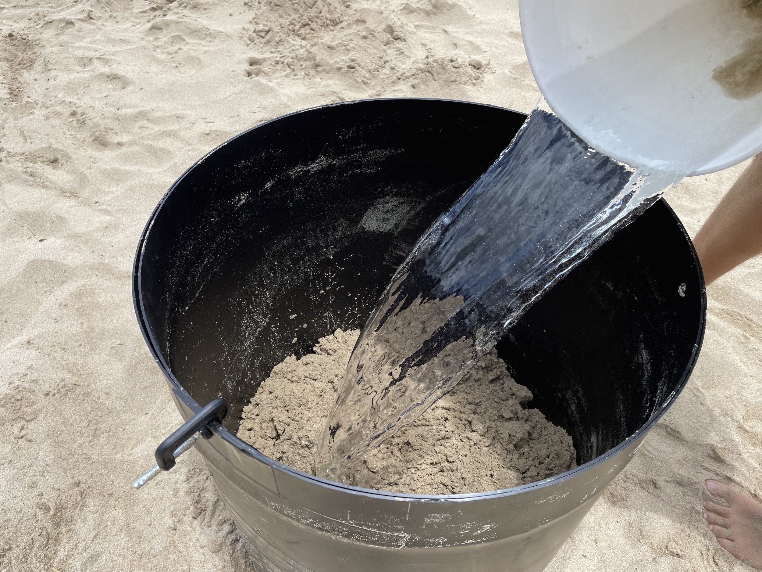 How to use sand and water to create a sand castle