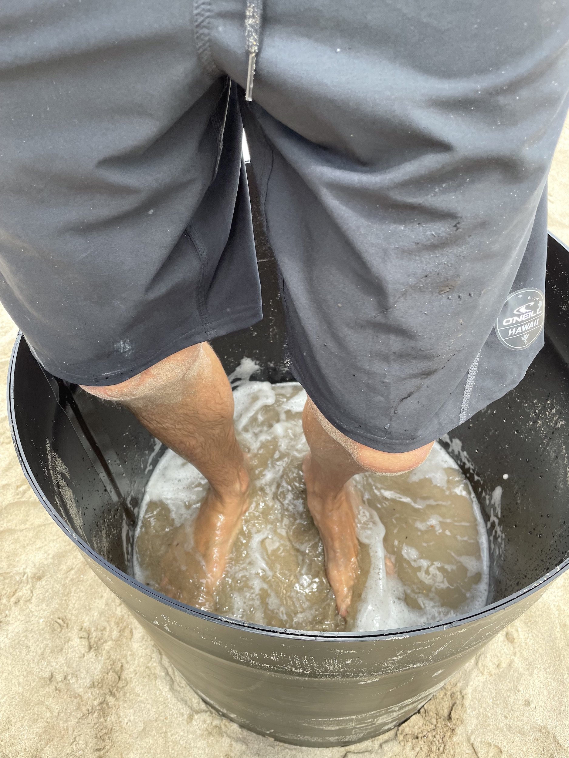 use your feet to compact sand at the beach to create a sand sculpture